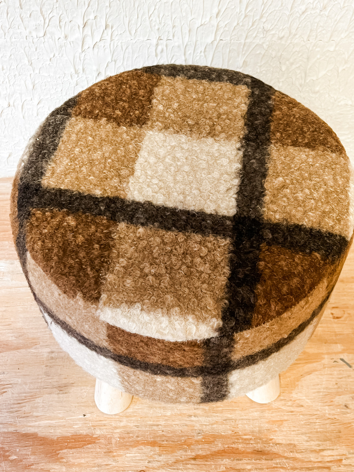cozy plaid sherpa cozy ottoman at the rustic barn in killingworth ct