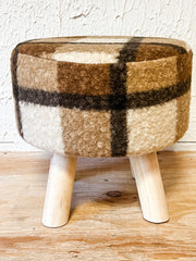 cozy plaid sherpa cozy ottoman at the rustic barn in killingworth ct