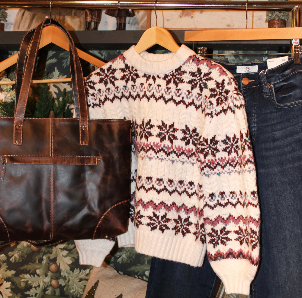 Beautiful winter outfits for women cozy knit sweater with dark denim jeans and a rich chocolate colored large purse bag for sale at the rustic barn in killingworth, CT
