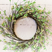 wreath made of vines green leaves and cream berries at the rustic barn in killingworth ct
