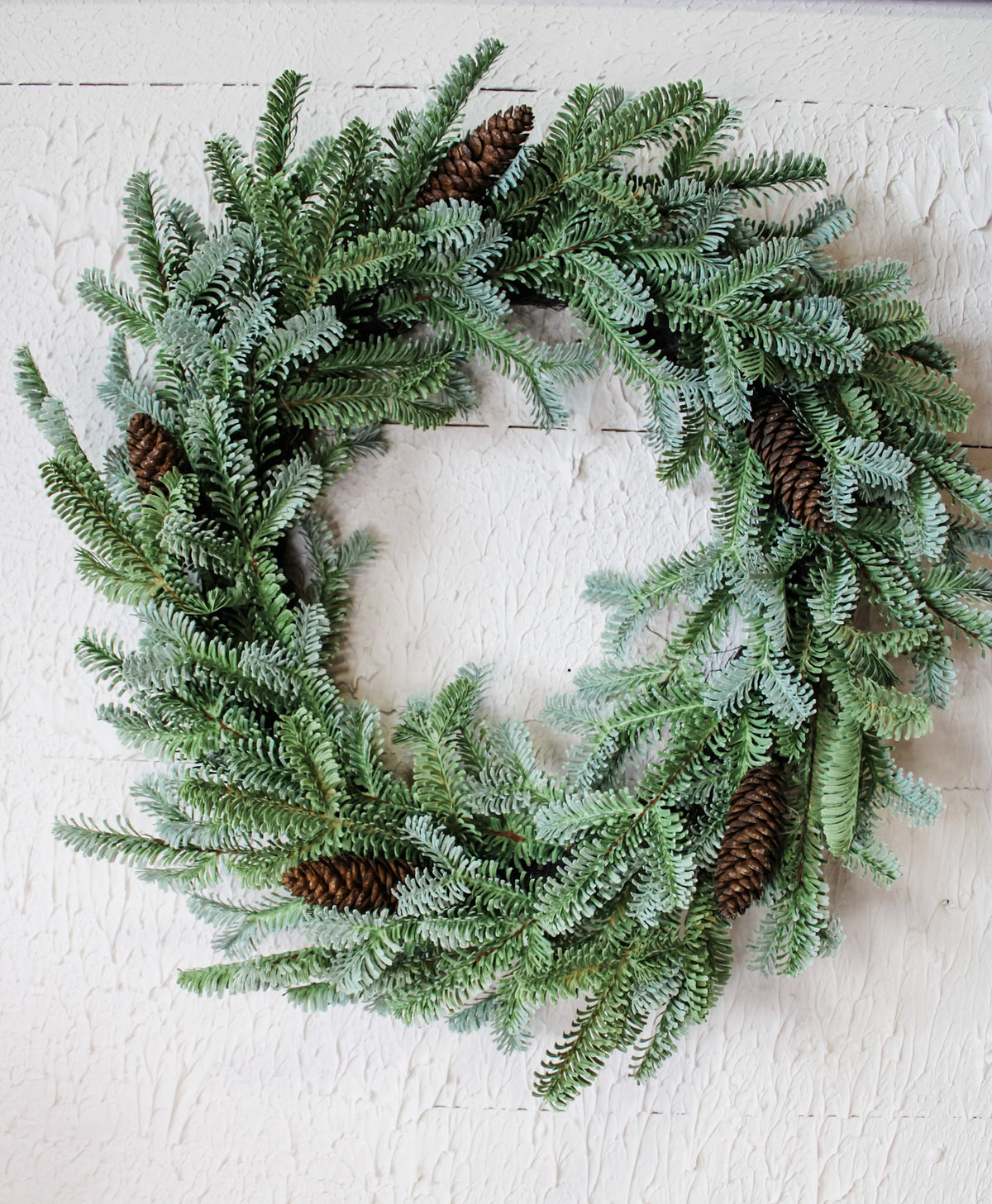 Deluxe evergreen christmas wreath with pinecone details for the holidays and winter decorating for sale at the rustic barn in Killingworth, CT