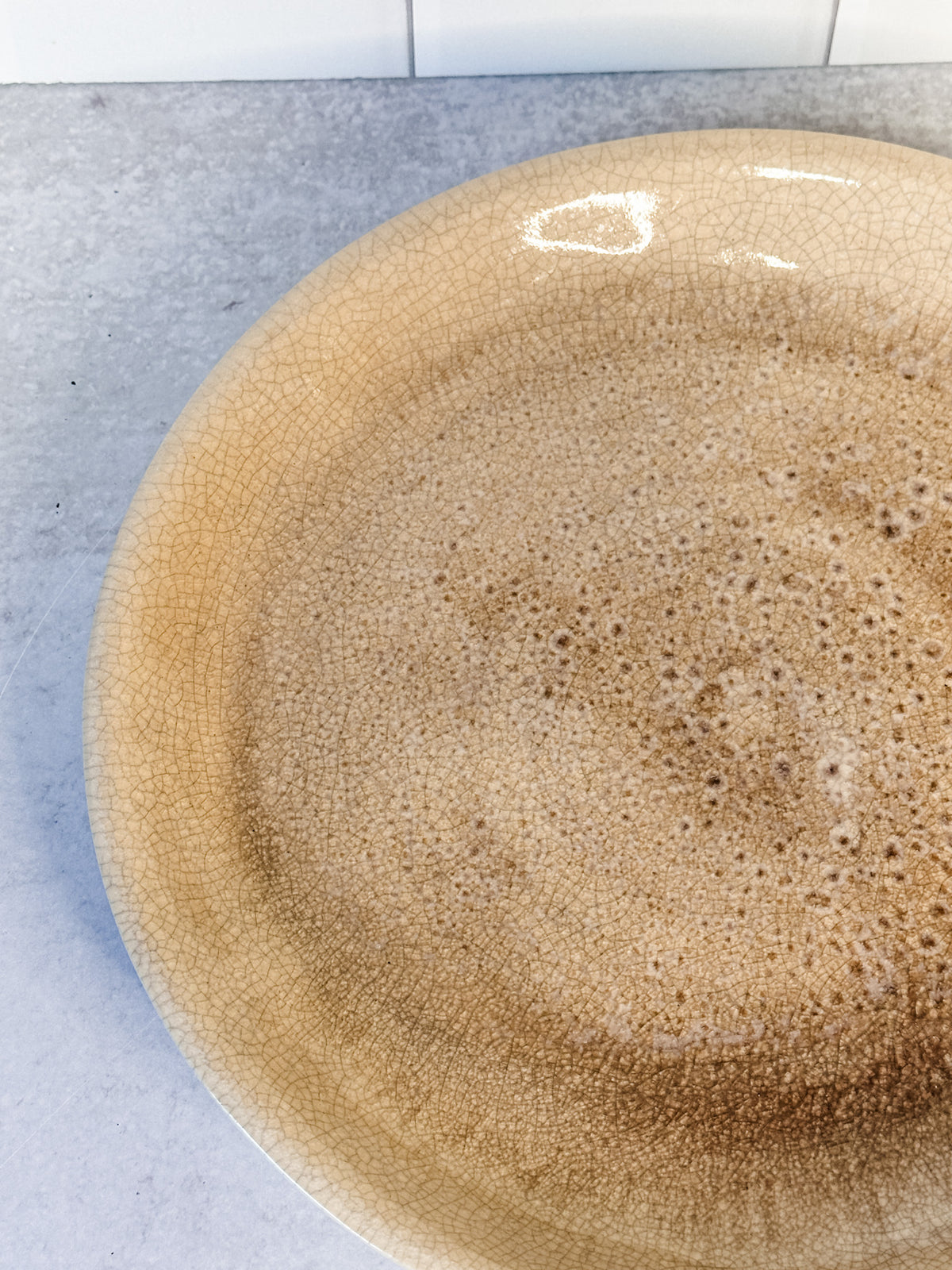 Distressed artisanal stoneware cream plate with crackle glaze finish from the rustic barn in killingworth, CT