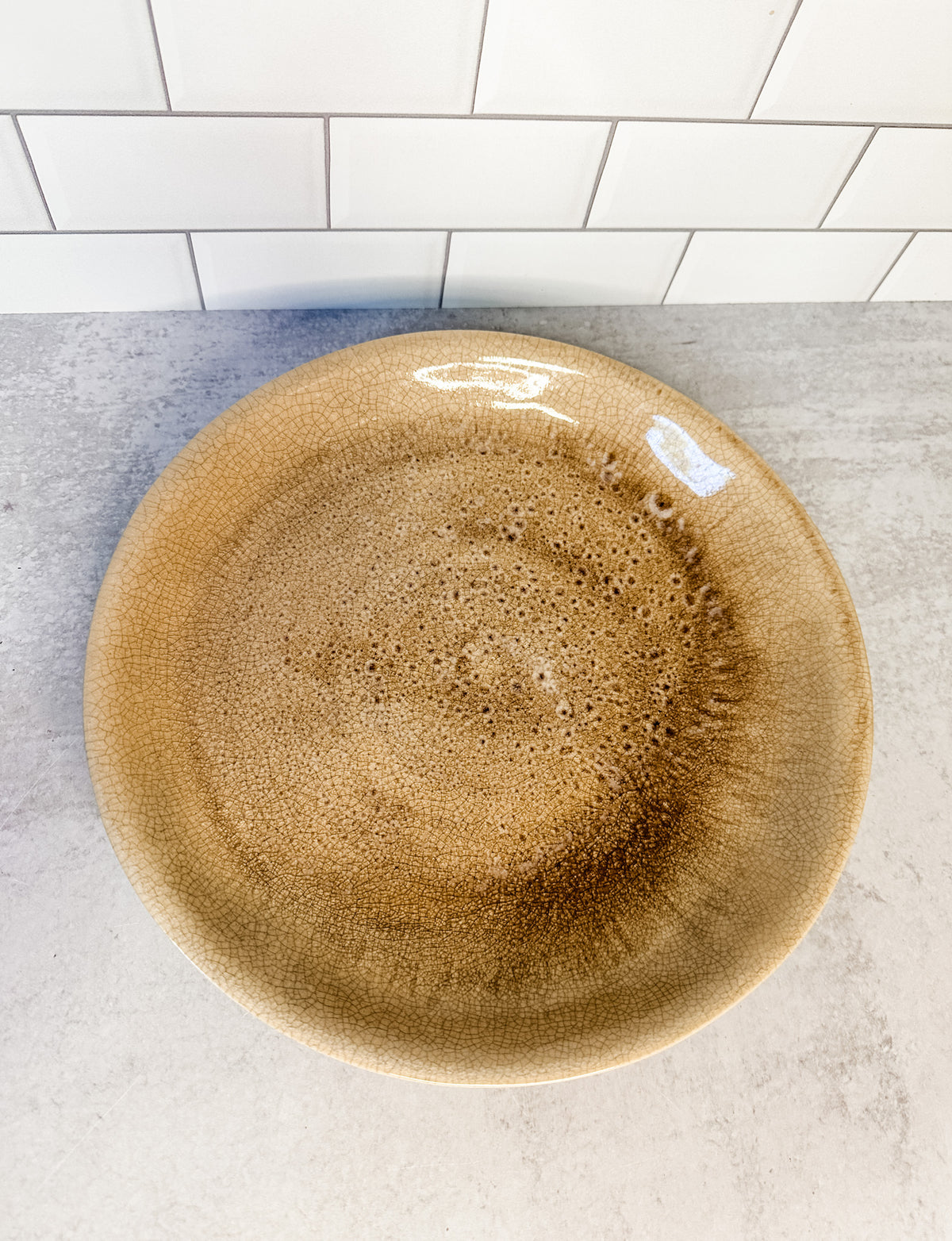 Distressed artisanal stoneware cream plate with crackle glaze finish from the rustic barn in killingworth, CT
