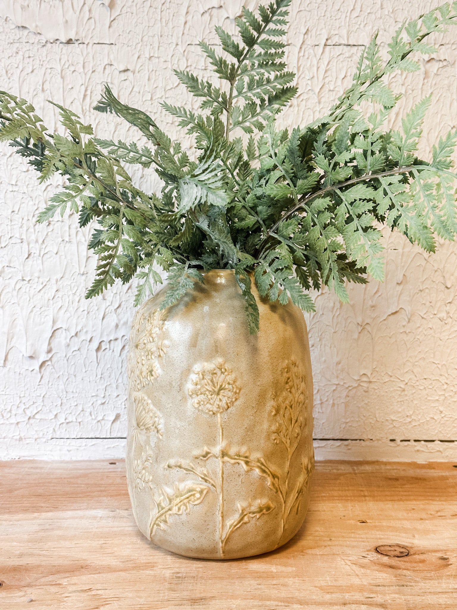 tan floral embossed ceramic vase at the rustic barn in killingworth ct