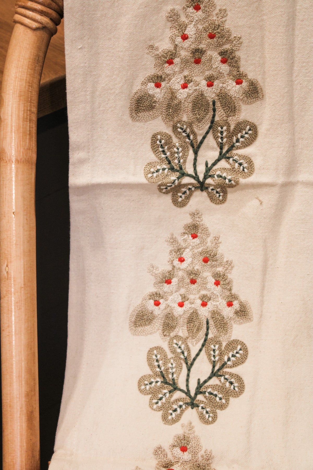 Embroidered Mistletoe cotton table runner with red berries and green florals and mistletoe for sale at the rustic barn in killingworth, CT