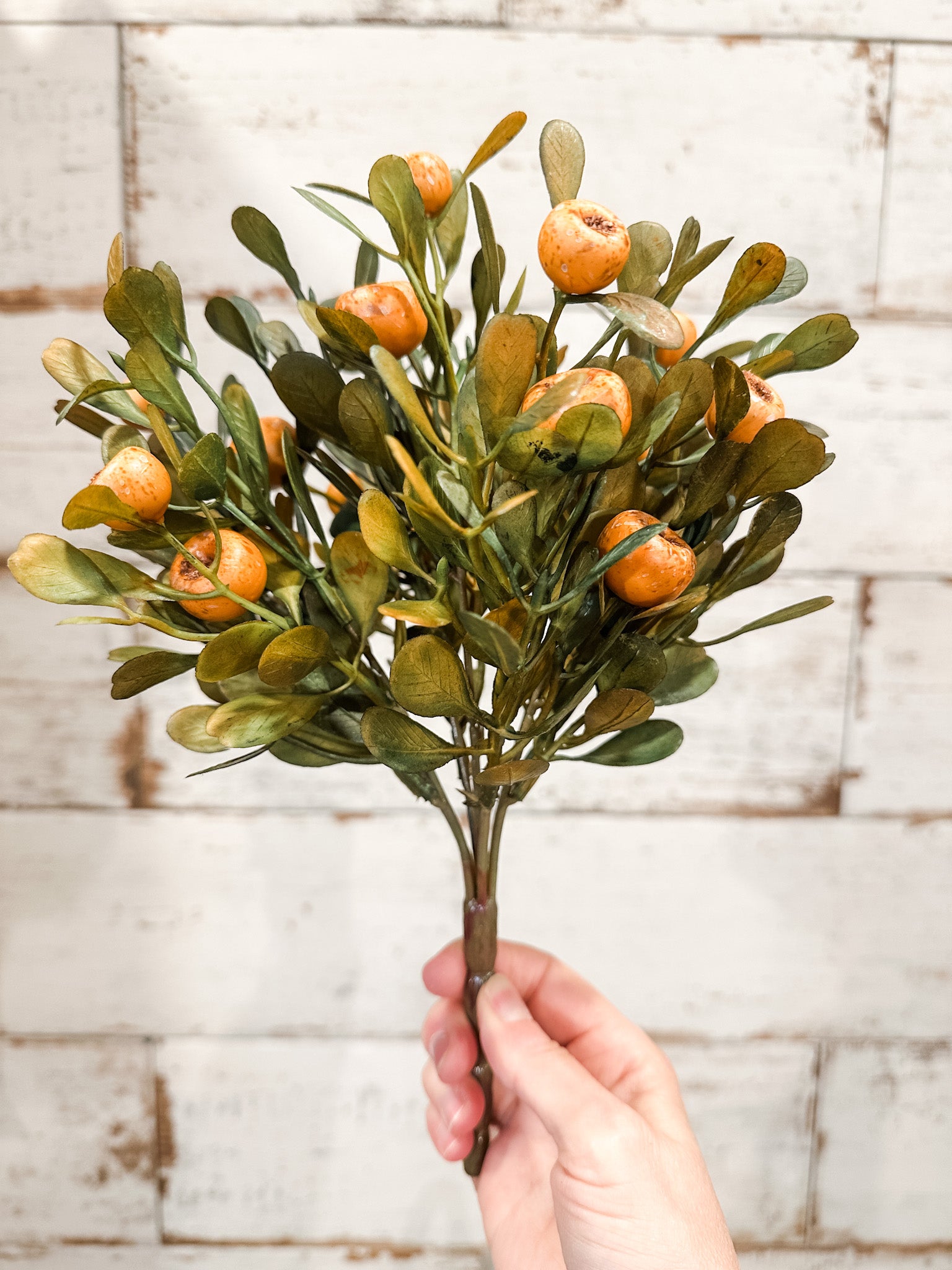 faux fall olive leaf and orange pod stem at the rustic barn in killingworth ct