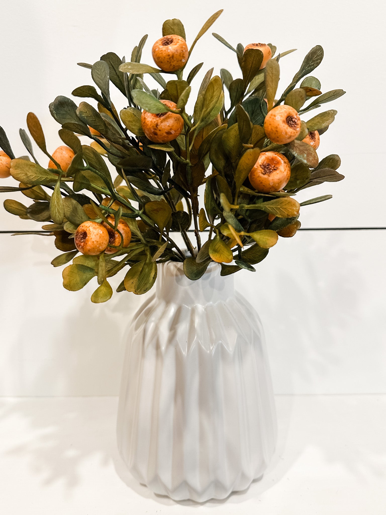 faux fall olive leaf and orange pod stem at the rustic barn in killingworth ct