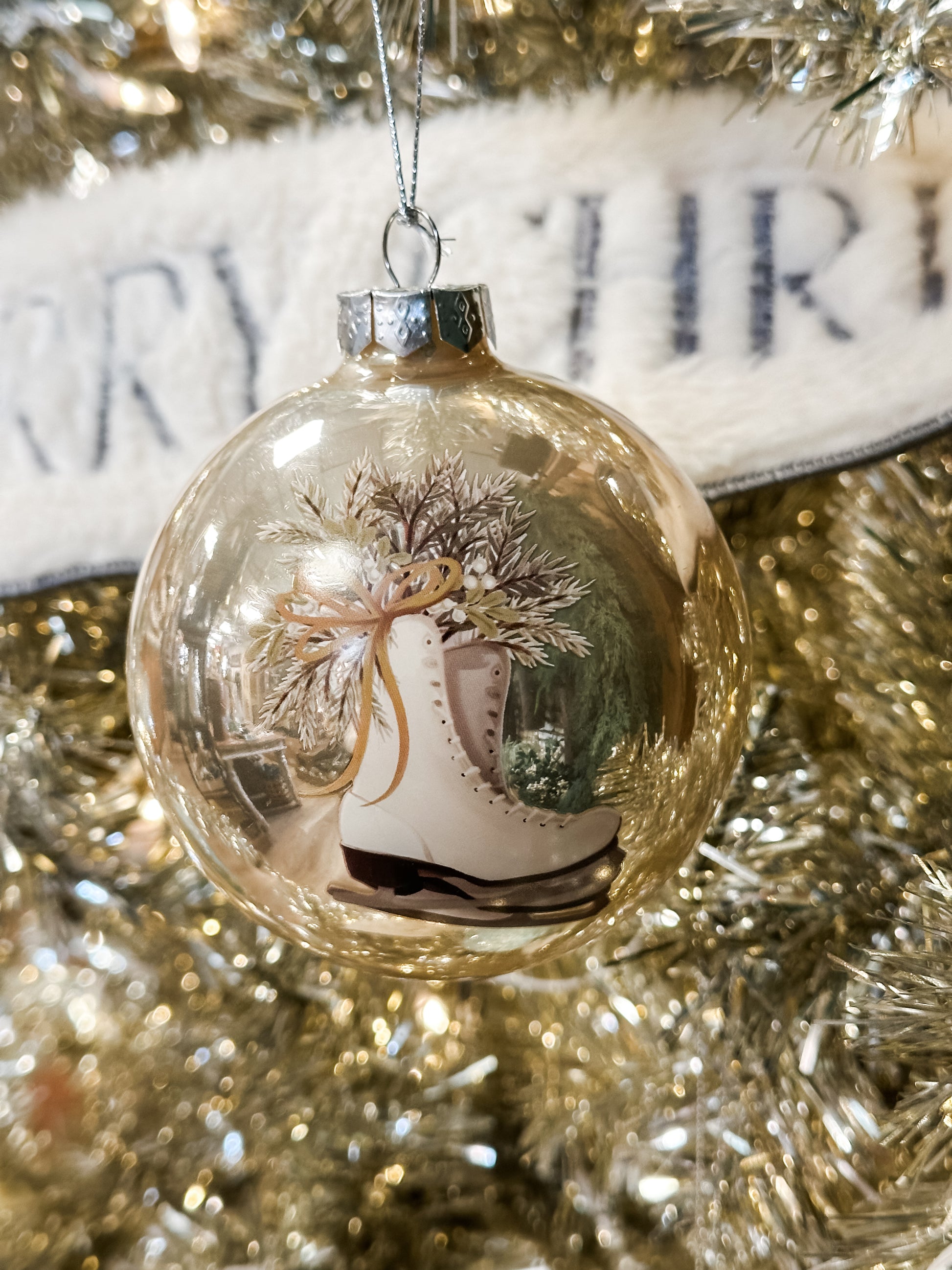frosted round ornament with picture of skates at The Rustic Barn in Killingworth CT