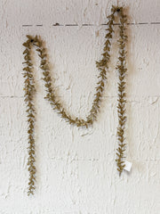 faux boxwood garland with gold glitter at The Rustic Barn in Killingworth CT