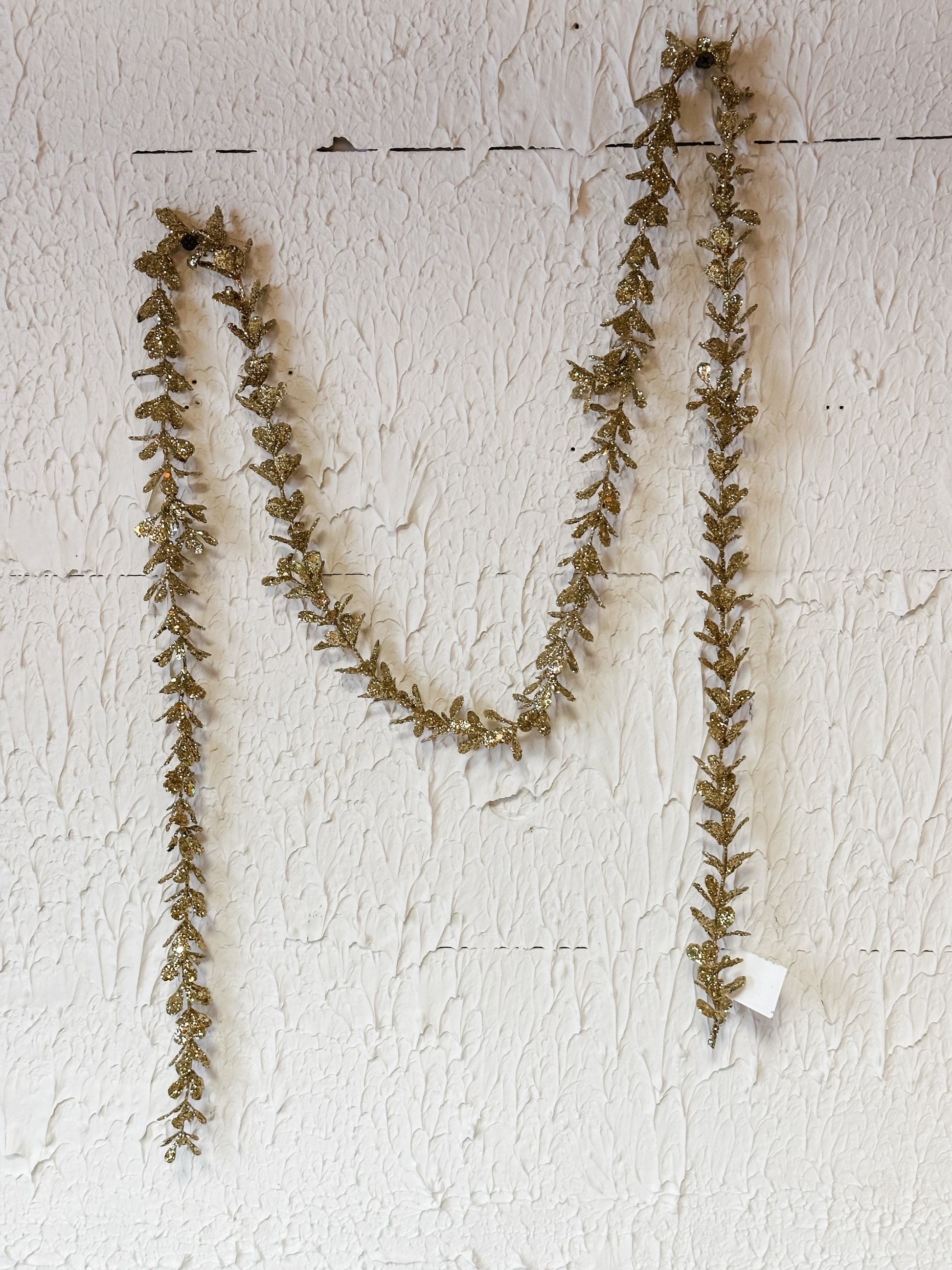 faux boxwood garland with gold glitter at The Rustic Barn in Killingworth CT