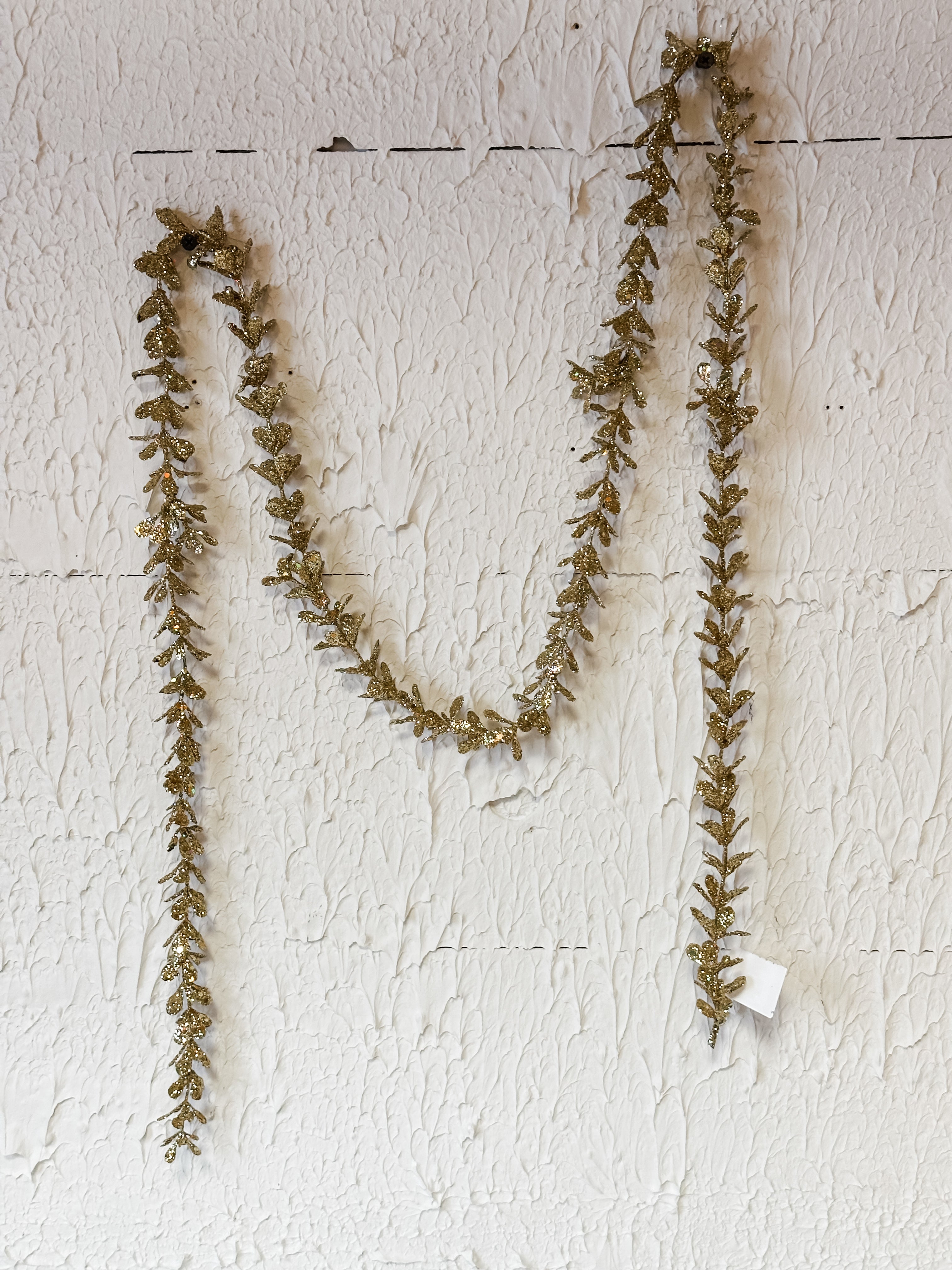 faux boxwood garland with gold glitter at The Rustic Barn in Killingworth CT