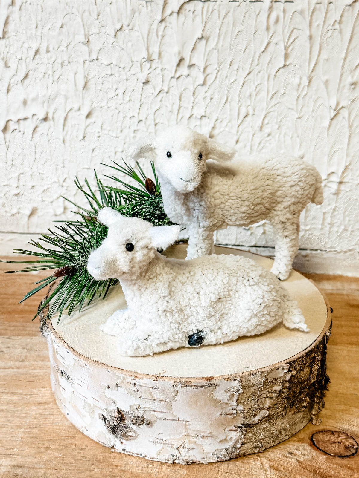 standing and resting faux fur sheep for christmas at the rustic barn in killingworth, CT