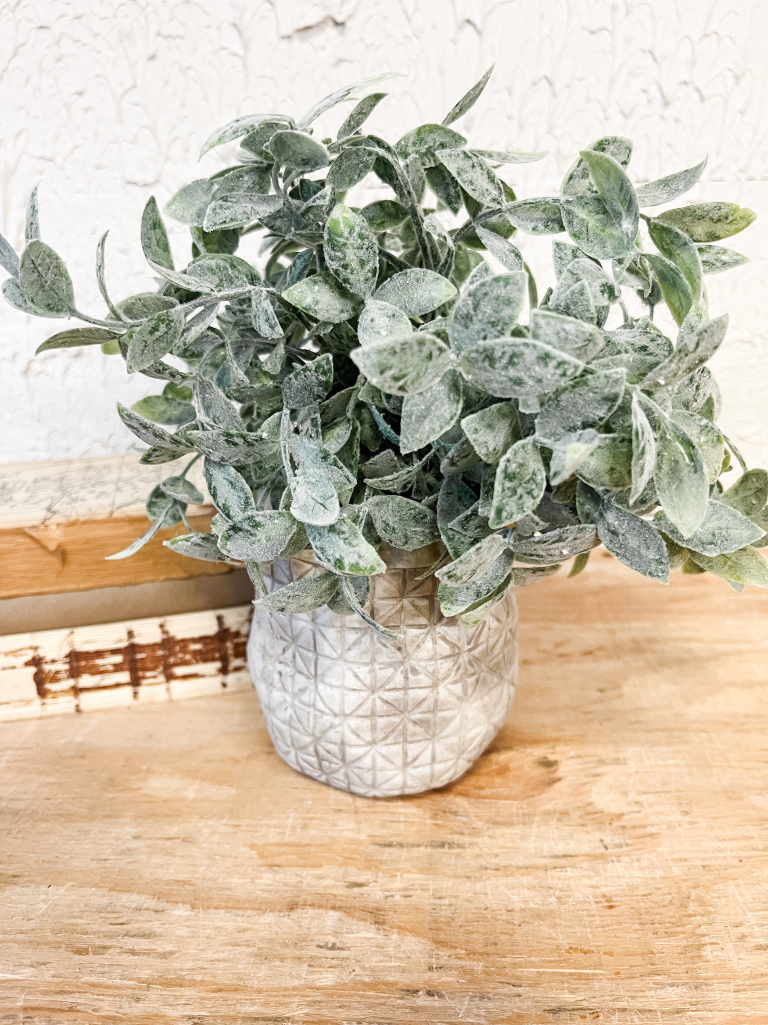 faux sage plant in a cement crisscross pot at the rustic barn in killingworth ct