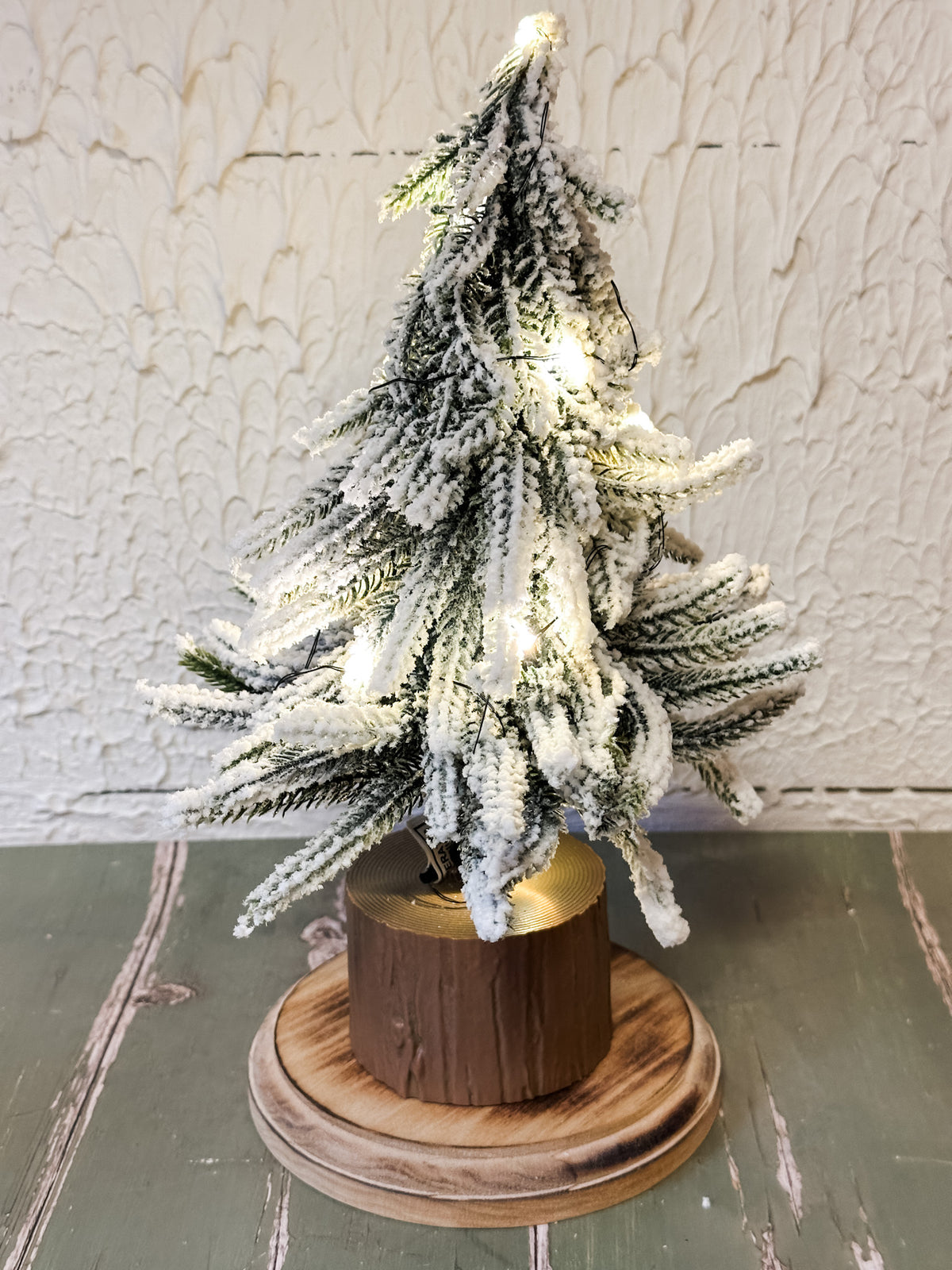 faux winter trees on wood base with LED lights at the rustic barn in killingworth ct