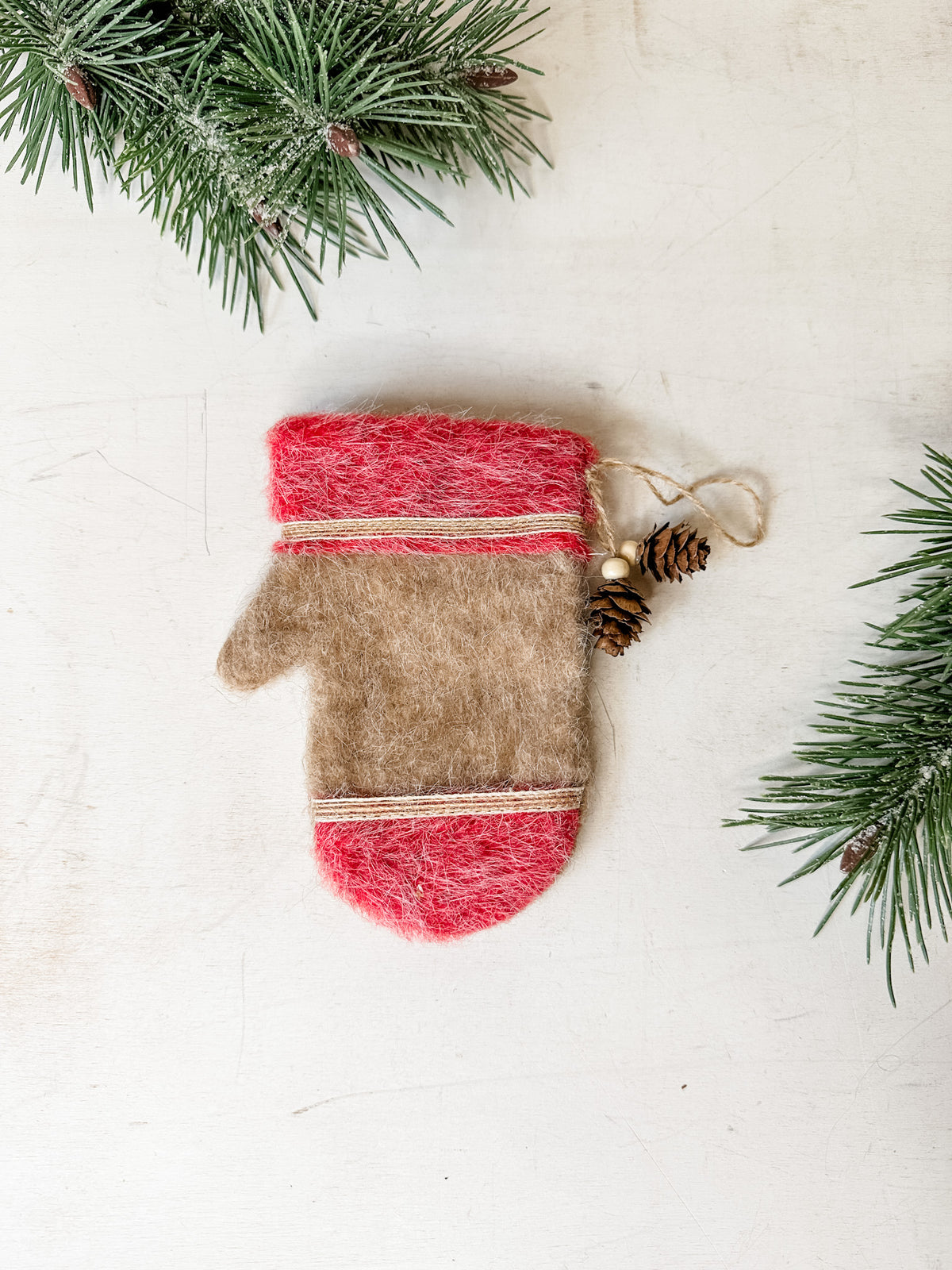 Felt mitten ornaments with pinecone detail for christmas for sale at the rustic barn in killingworth, CT tan color
