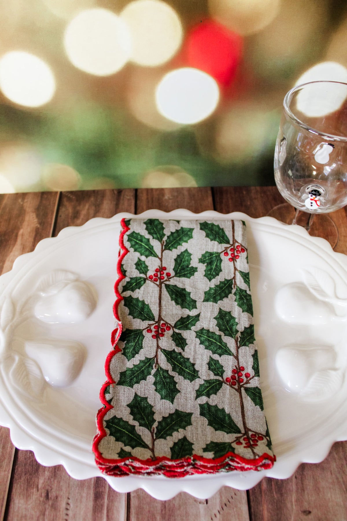 Festive green red and white holiday christmas napkins set of 4 with white berries, poinsettias, holly, red berries, and christmas prints with scalloped edge for sale at the rustic barn in killingworth, CT