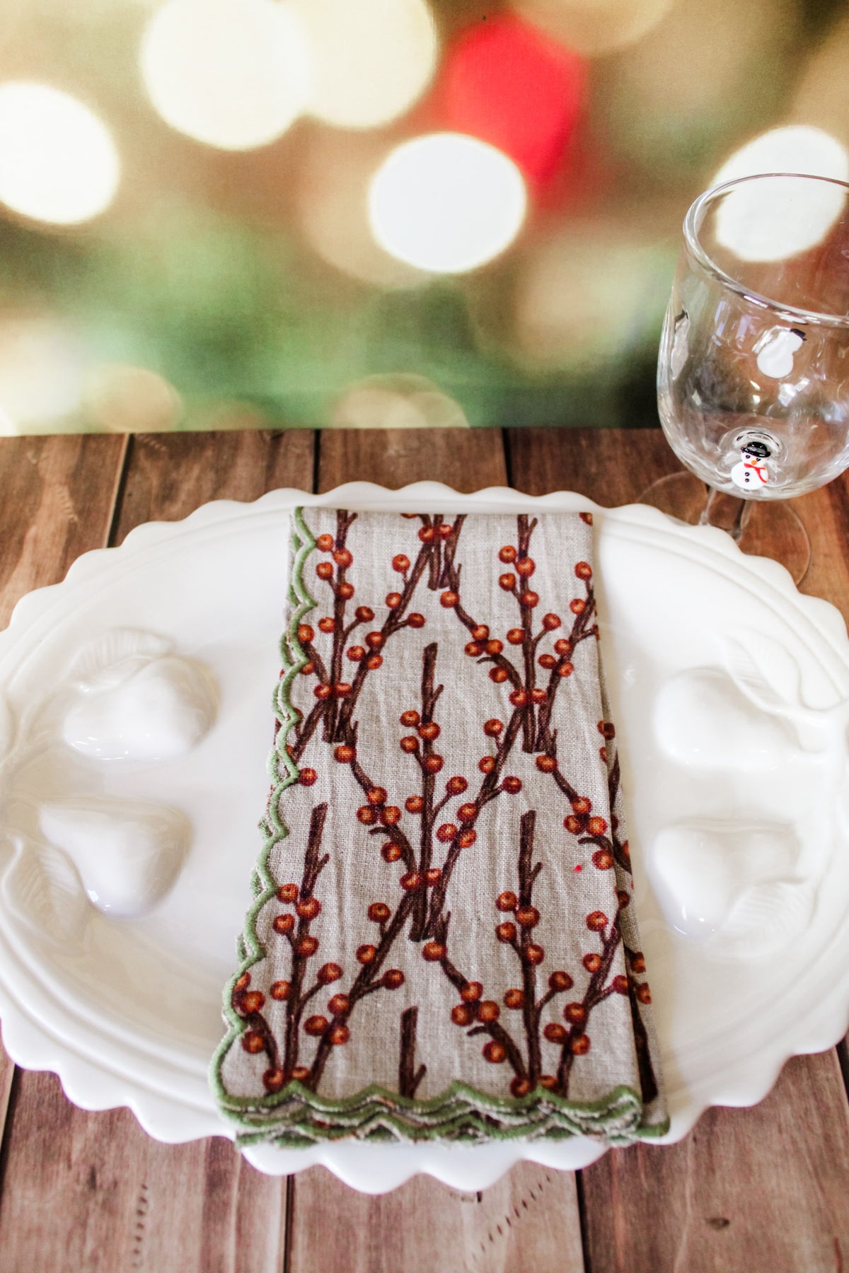 Festive green red and white holiday christmas napkins set of 4 with white berries, poinsettias, holly, red berries, and christmas prints with scalloped edge for sale at the rustic barn in killingworth, CT