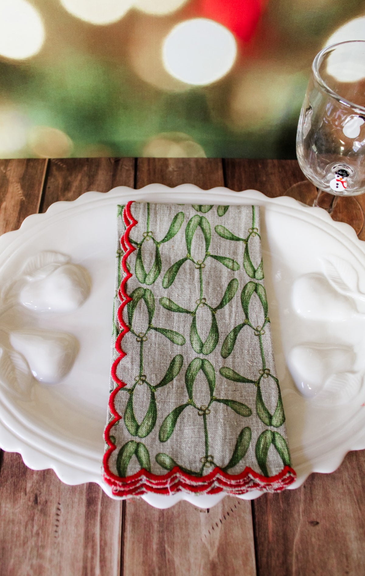Festive green red and white holiday christmas napkins set of 4 with white berries, poinsettias, holly, red berries, and christmas prints with scalloped edge for sale at the rustic barn in killingworth, CT