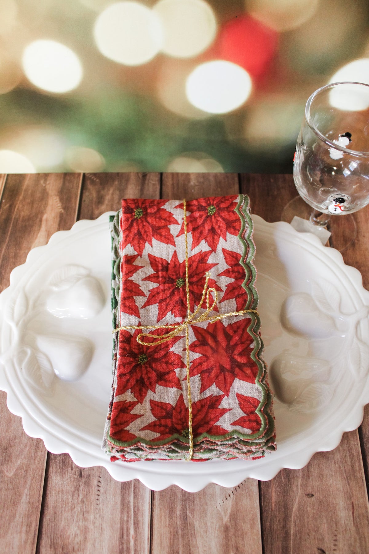 Festive green red and white holiday christmas napkins set of 4 with white berries, poinsettias, holly, red berries, and christmas prints with scalloped edge for sale at the rustic barn in killingworth, CT