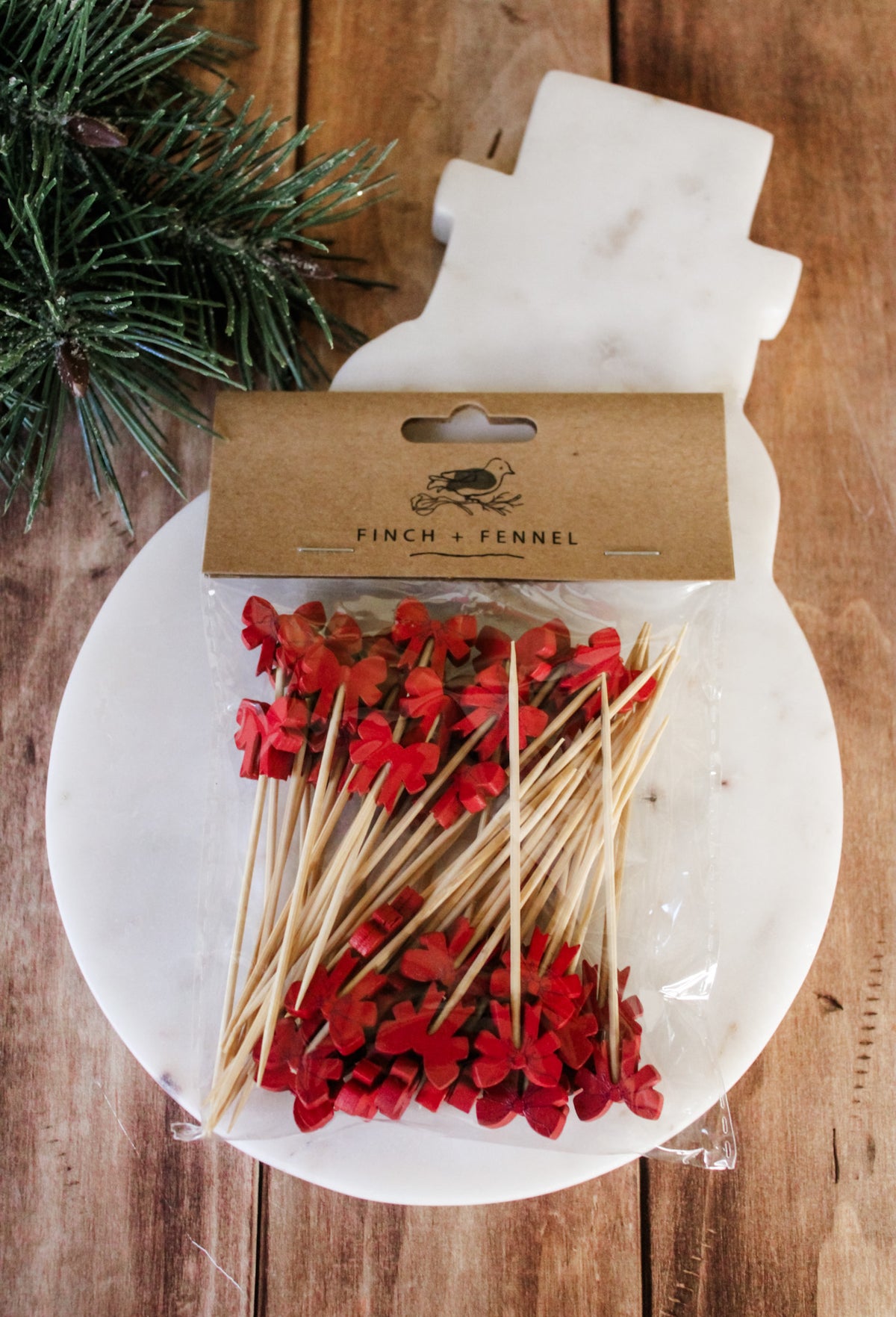 Festive red bow bamboo appetizer sticks for charcuterie and serving for christmas and holiday hosting for sale at the rustic barn in Killingworth, CT