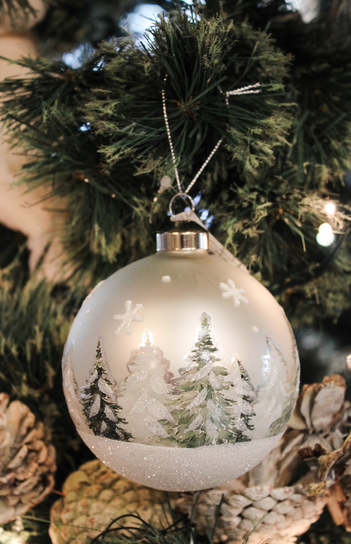 Frosted evergreen glass ball ornaments winter forest scene for Christmas 