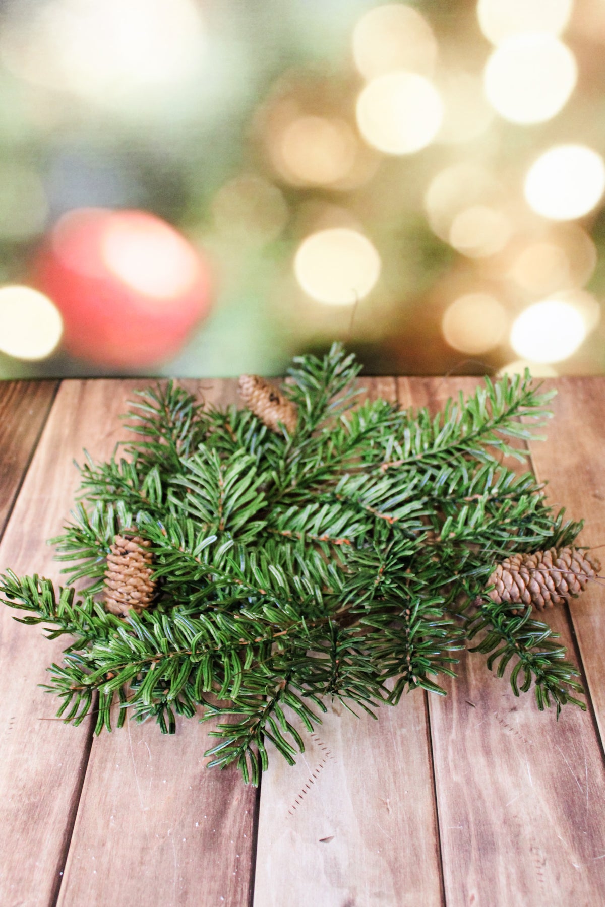 Frosted glacier ultra realistic candle ring with pinecones and greenery for winter and christmas for sale at the rustic barn in Killingworth, CT