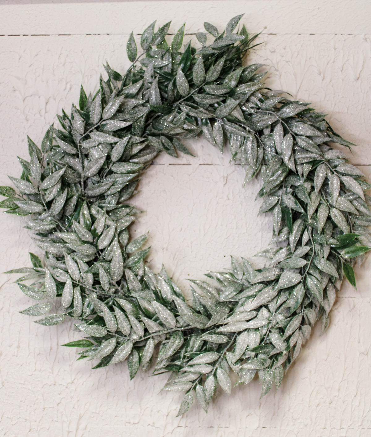 frosted green nandina leaf wreath with sparkles and green leaves for winter and christmas for sale at the rustic barn in killingworth, CT
