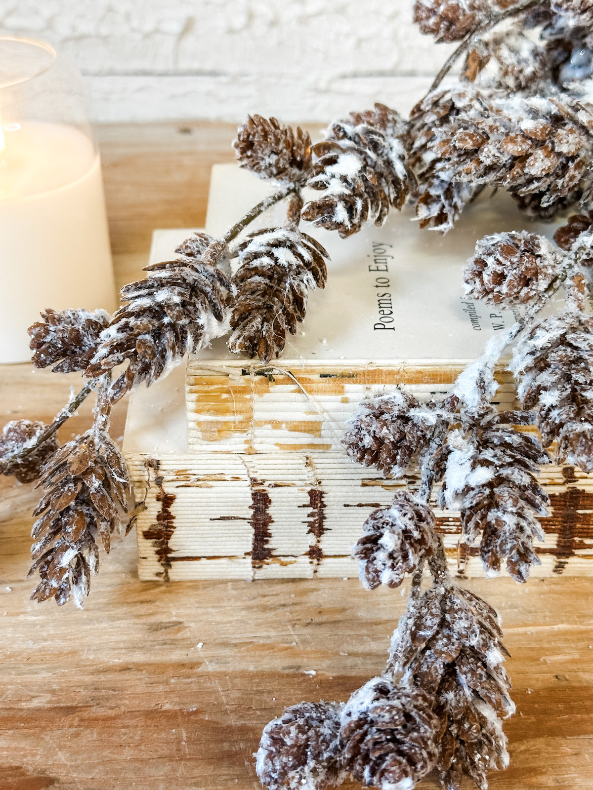 snow covered frosted pinecone spray at the rustic barn in killingworth ct