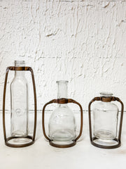 glass bottle vase in metal stand at The Rustic Barn in Killingworth, CT