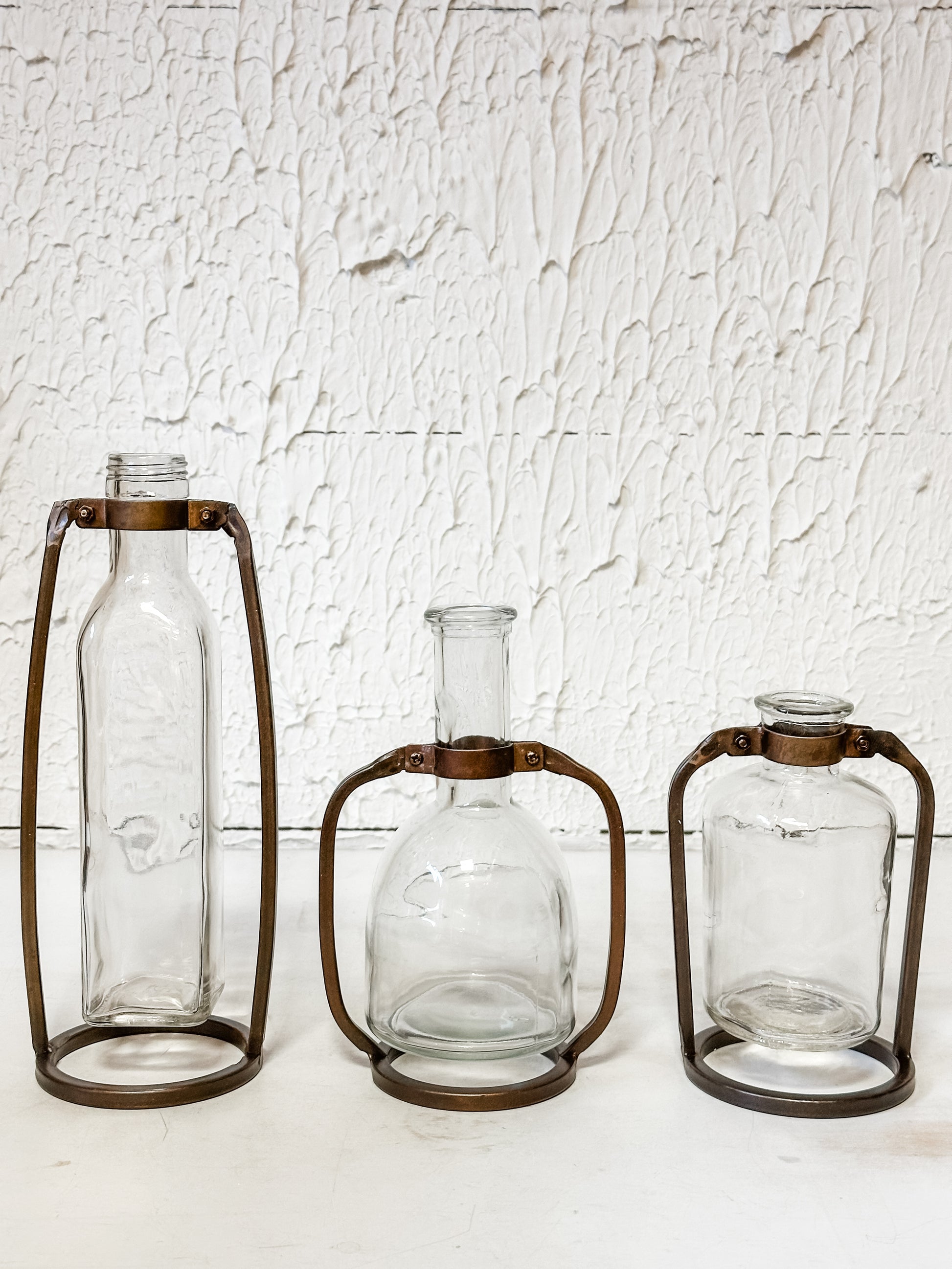 glass bottle vase in metal stand at The Rustic Barn in Killingworth, CT