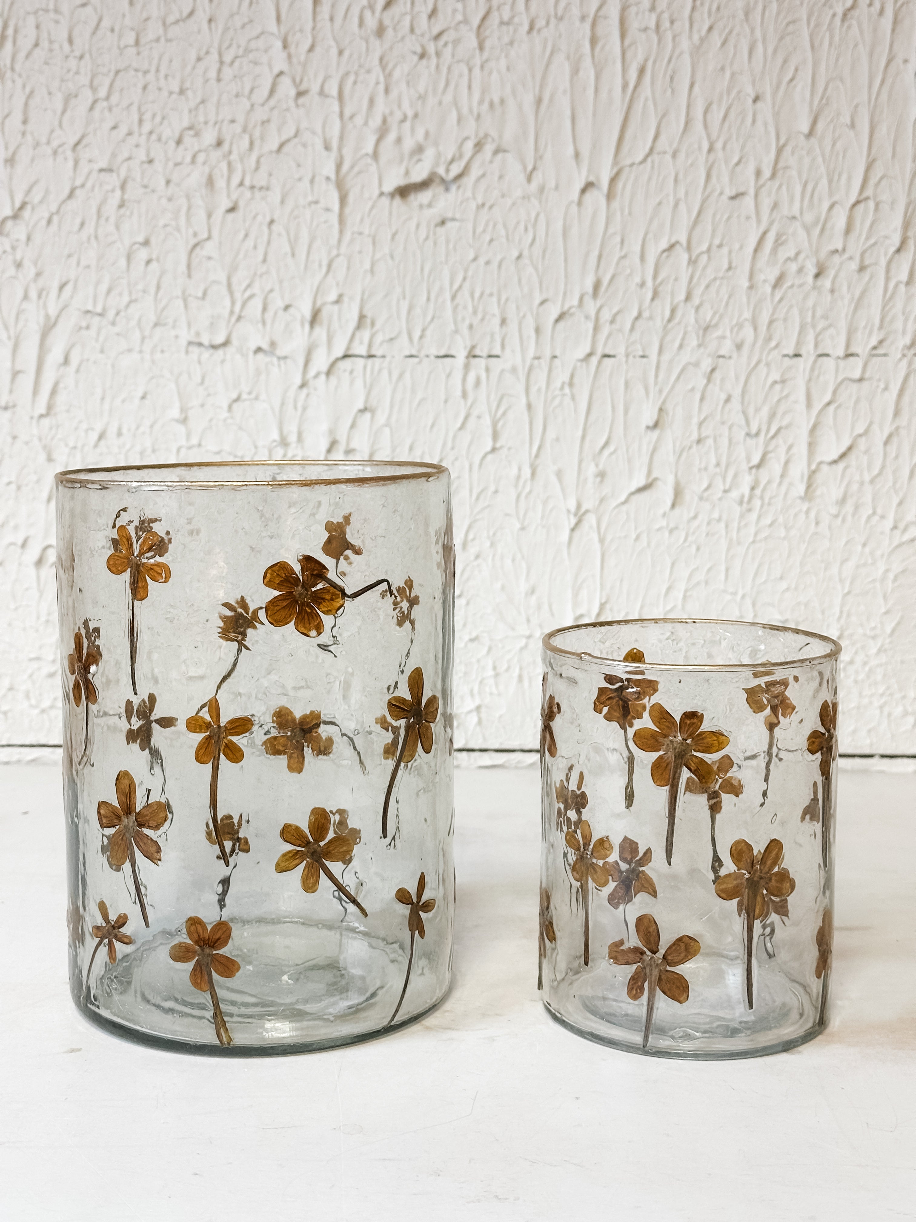 glass candle holder with pressed wildflower at The Rustic Barn in Killingworth, CT