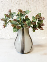 glass vase with black and white stripes and faux florals at The Rustic Barn in Killingworth CT