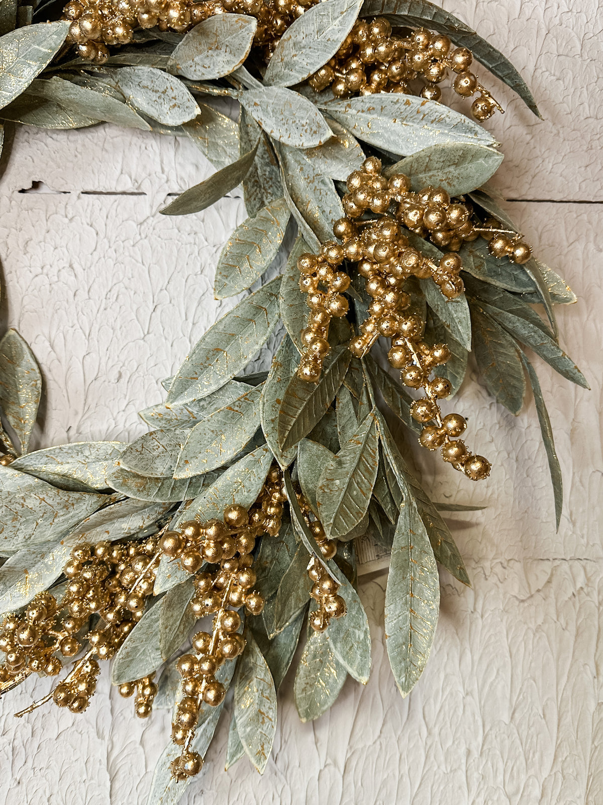 gilded gold berry and bay leaf holiday wrap wreath for the christmas season for sale at the rustic barn in killingworth, CT