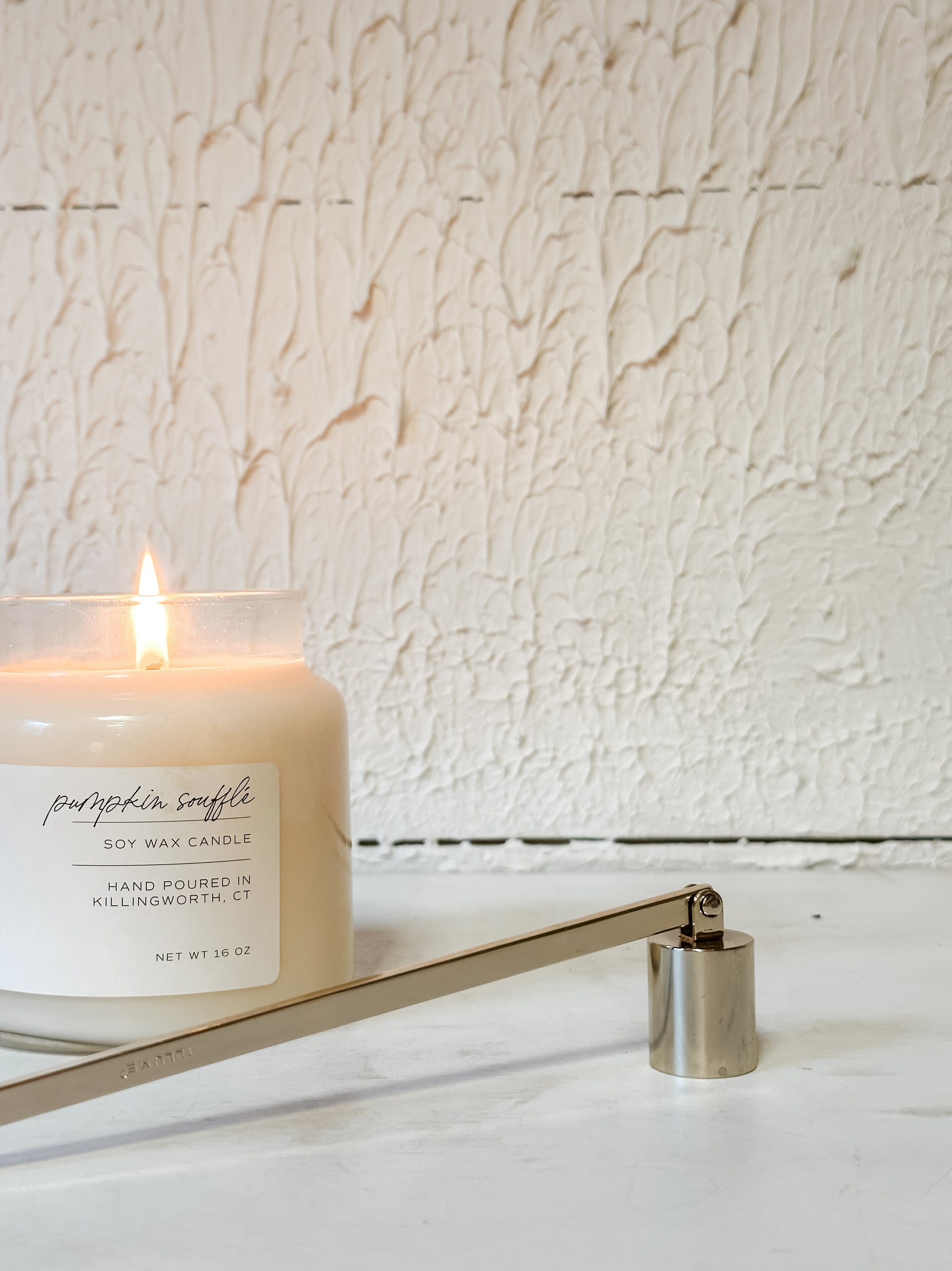 gold metal candle snuffer at the Rustic Barn in Killingworth CT