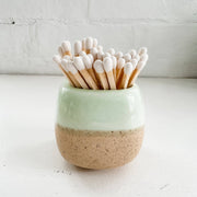 green ceramic match holder with matches at the rustic barn in Killingworth ct