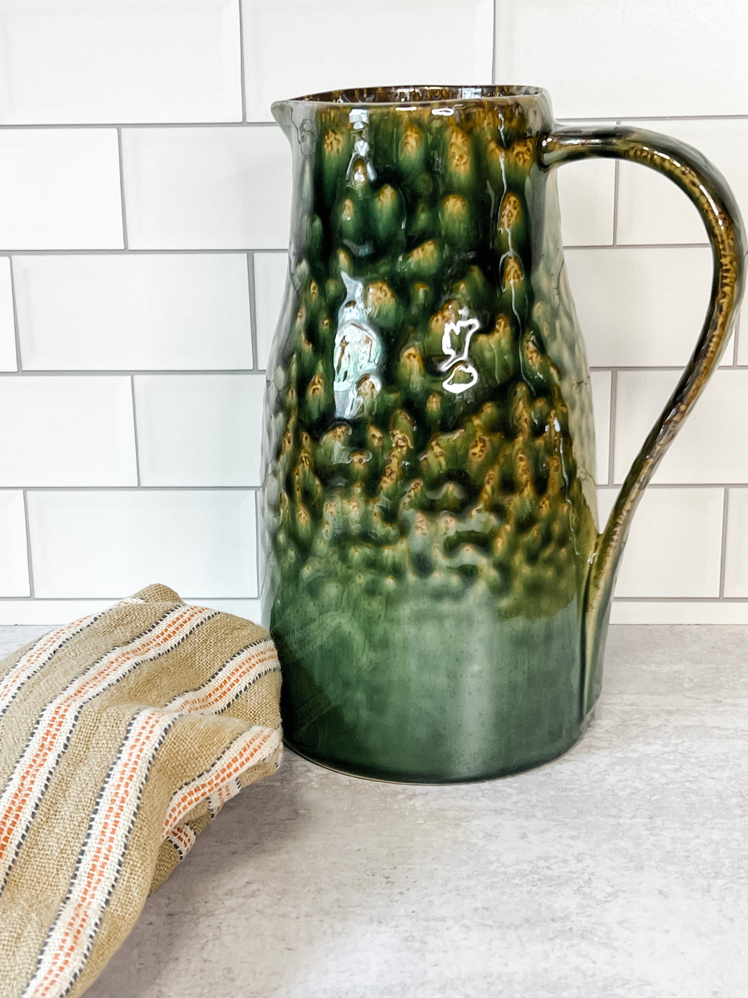 green stoneware pitcher at the rustic barn in killingworth ct