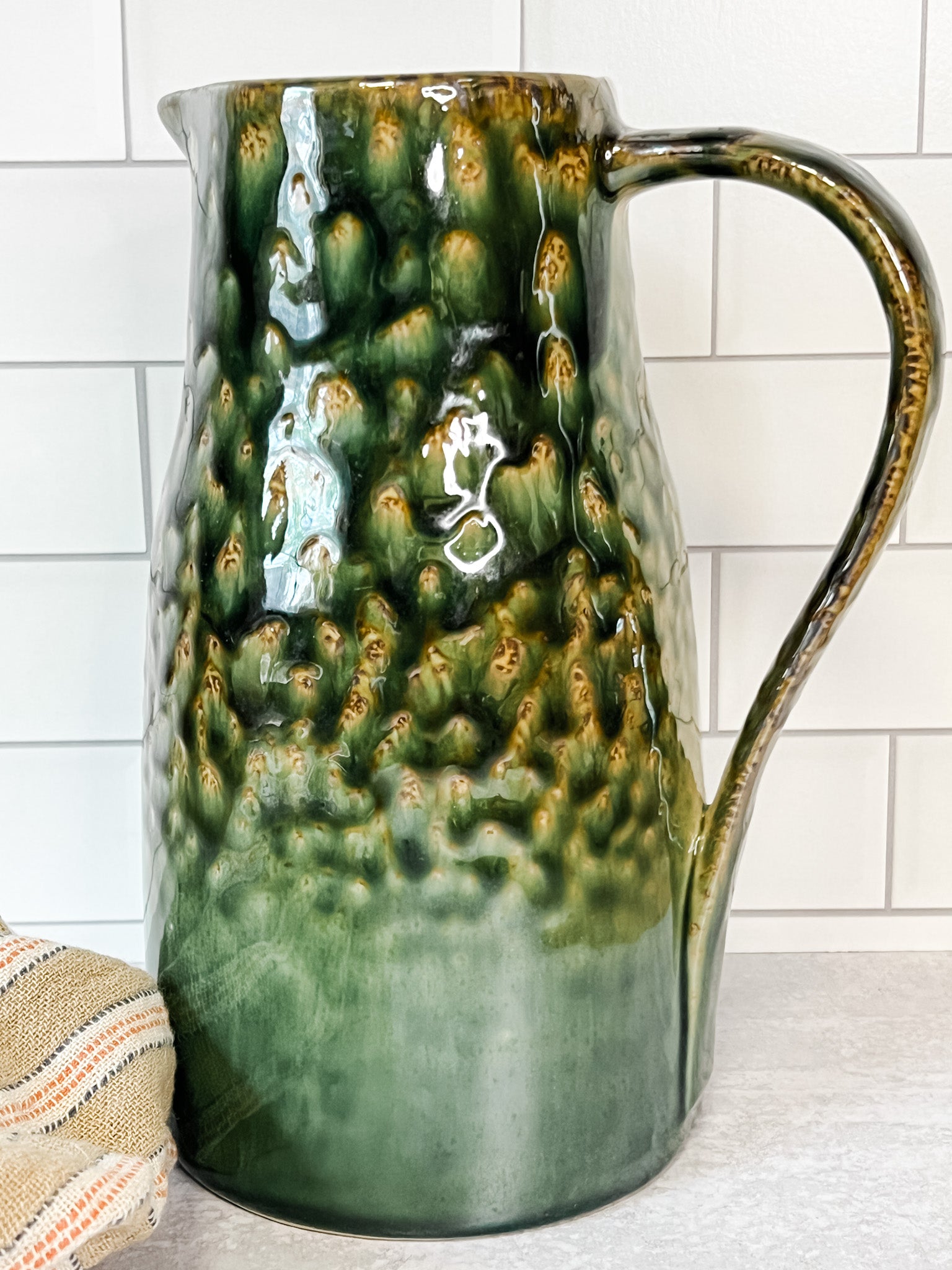 green stoneware pitcher at the rustic barn in killingworth ct