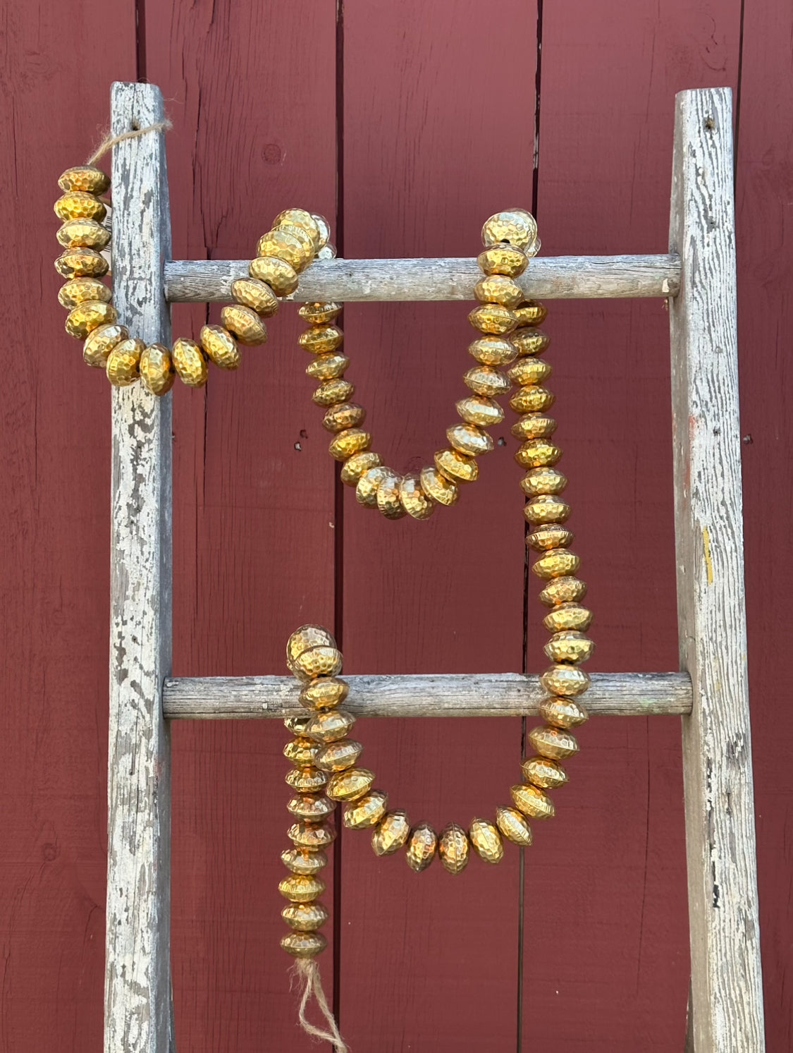 hammered metal brass beaded Christmas garland at the Rustic Barn in Killingworth CT