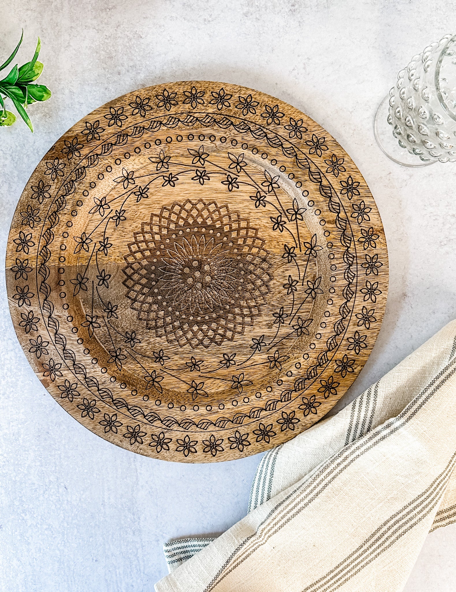 hand carved mango wood floral plate charger at the rustic barn in killingworth ct