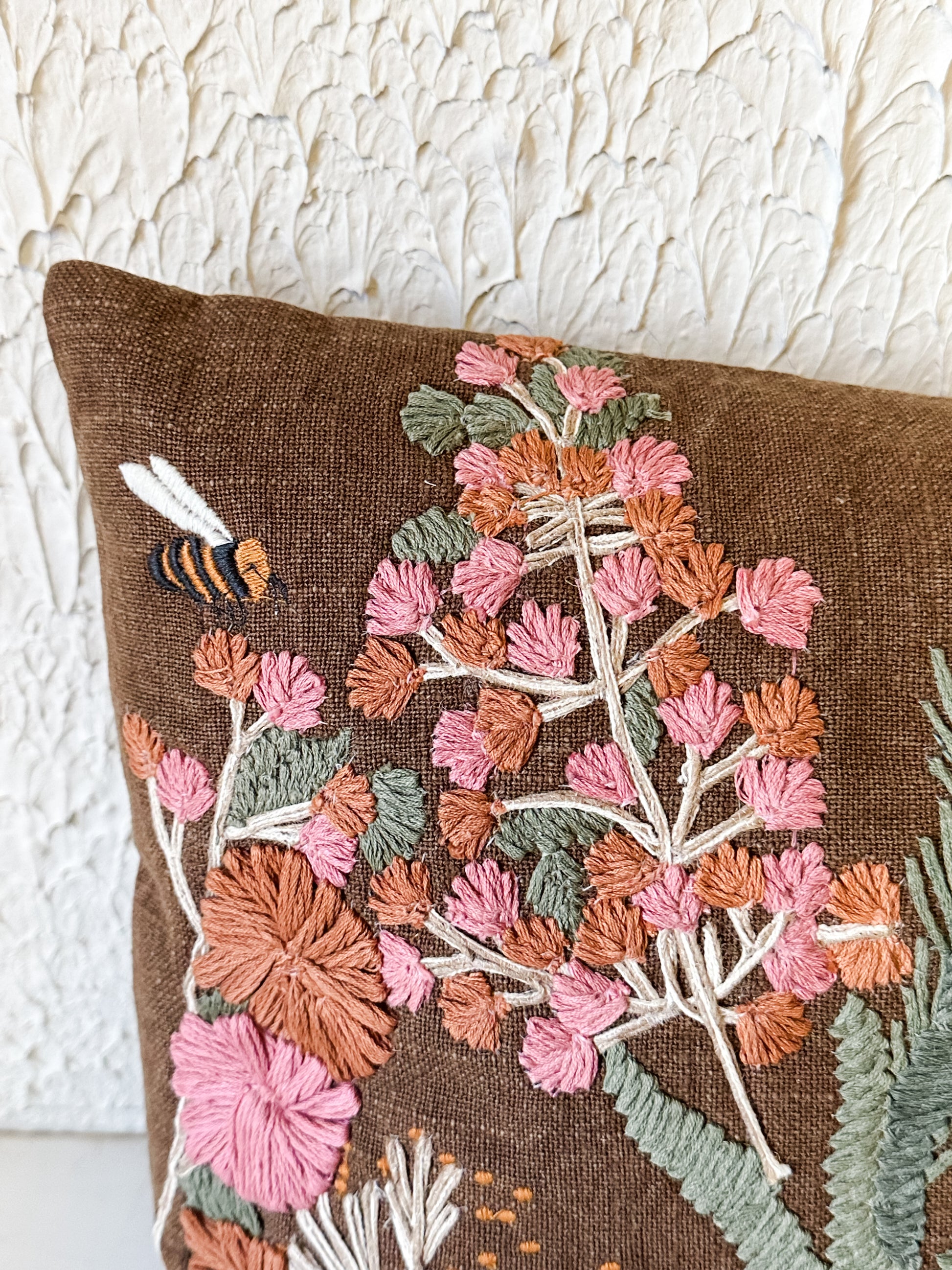 hand-embroidered floral and bee cotton lumbar pillow at the Rustic Barn in Killingworth, CT