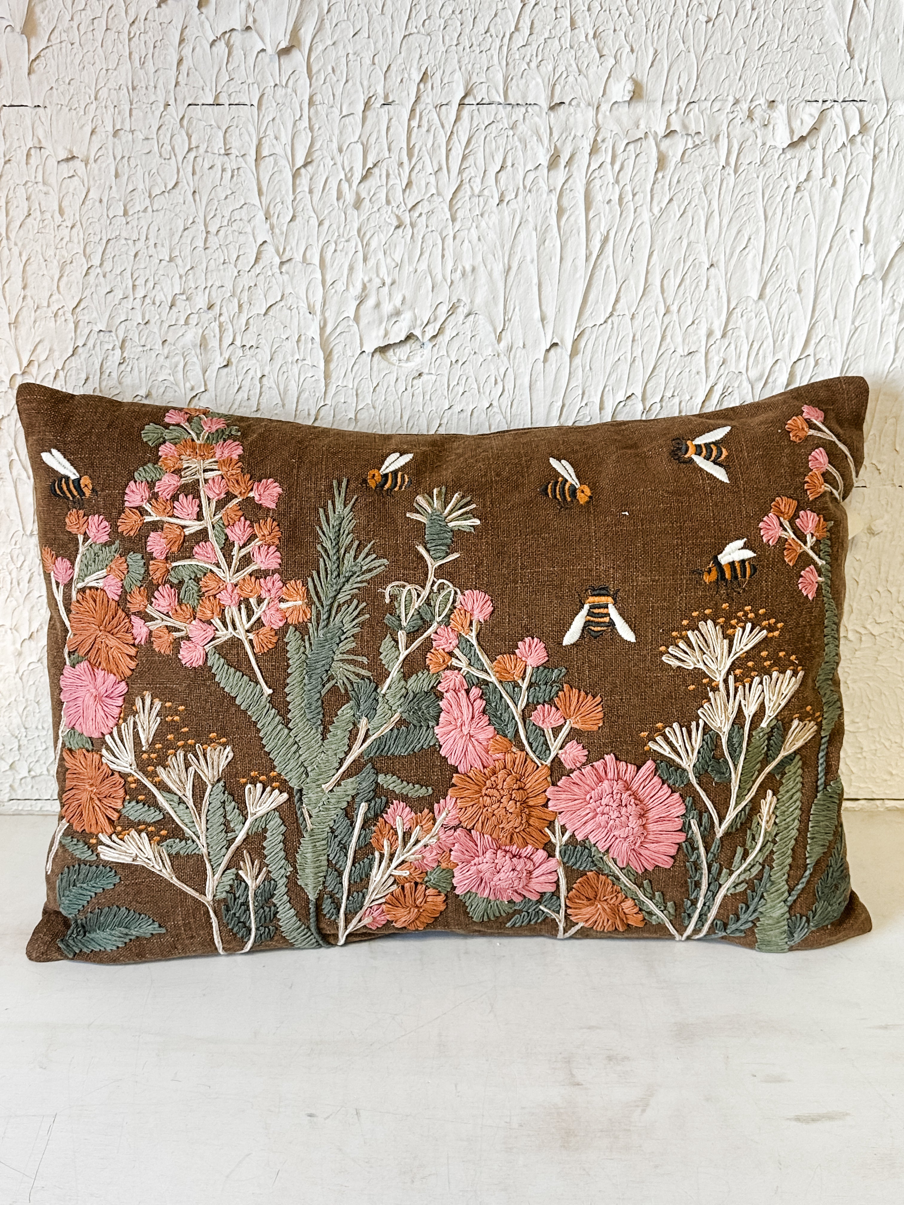 hand-embroidered floral and bee cotton lumbar pillow at the Rustic Barn in Killingworth, CT