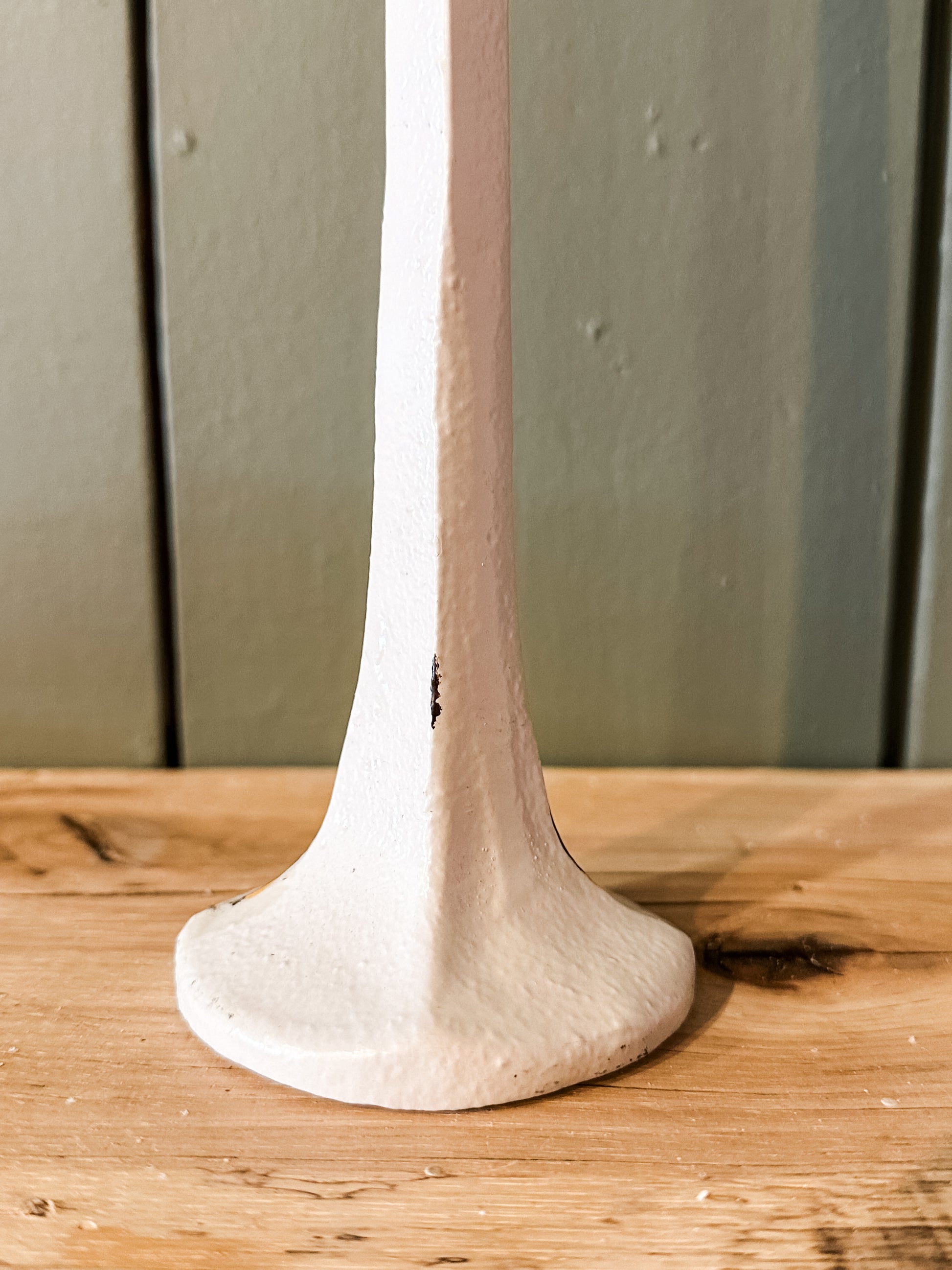 hand-forged metal taper holder with white finish at The Rustic Barn in Killingworth, CT