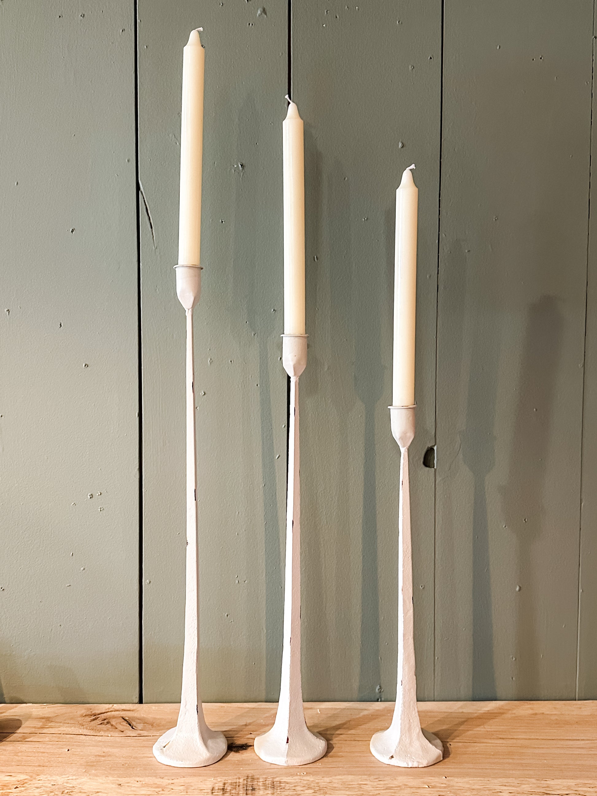 hand-forged metal taper holder with white finish at The Rustic Barn in Killingworth, CT