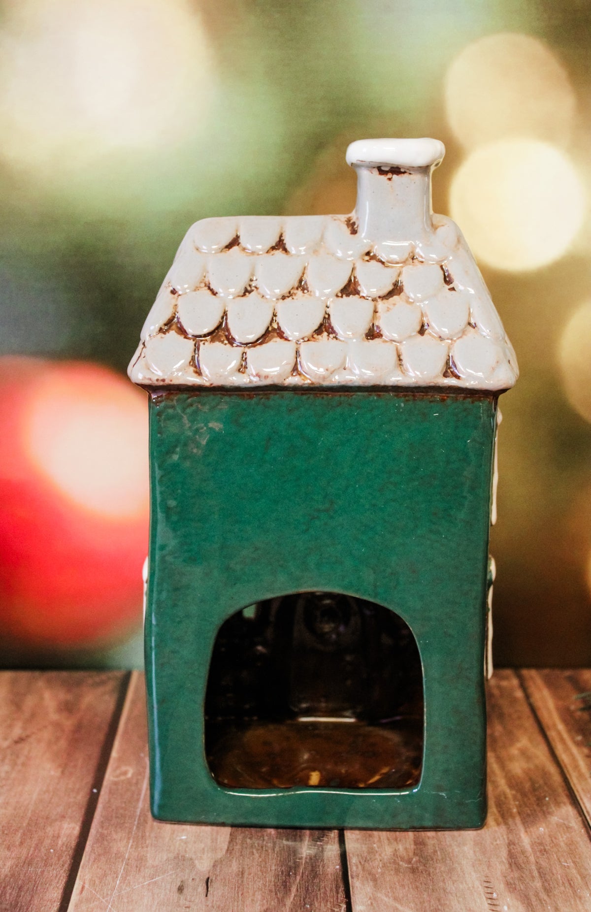 Hand painted holiday ceramic village houses with christmas trees, wreaths, bows, and lights with back open for candles and faux lights for sale at the rustic barn in Killingworth, CT