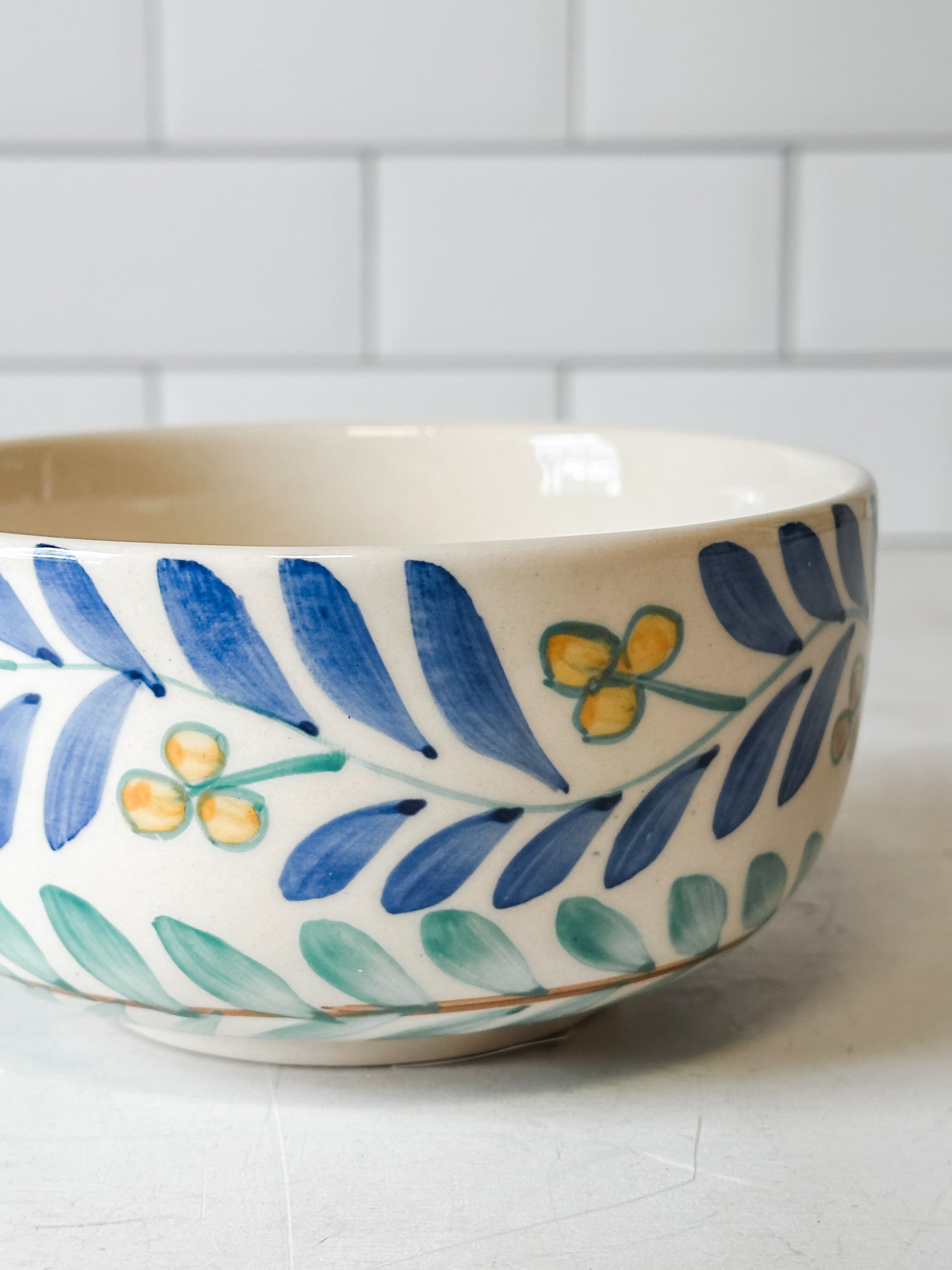 hand painted stoneware bowl with vine design at the rustic barn in killingworth ct