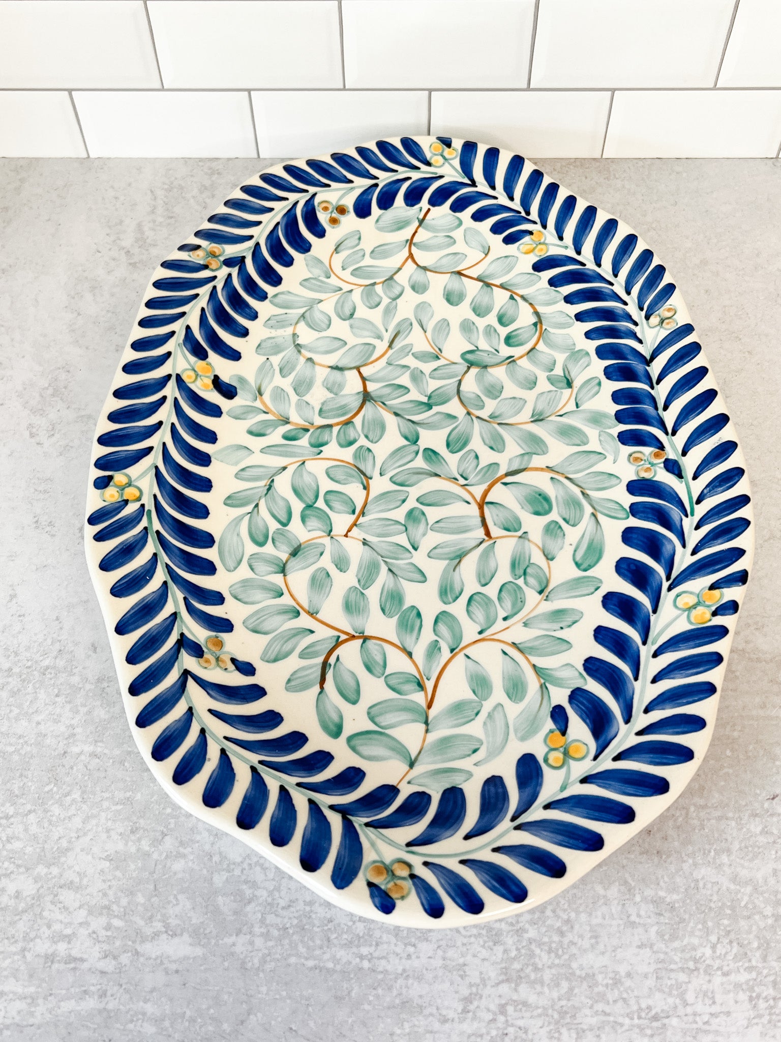 hand painted vine pattern blue and green stoneware oval platter at the rustic barn in killingworth ct