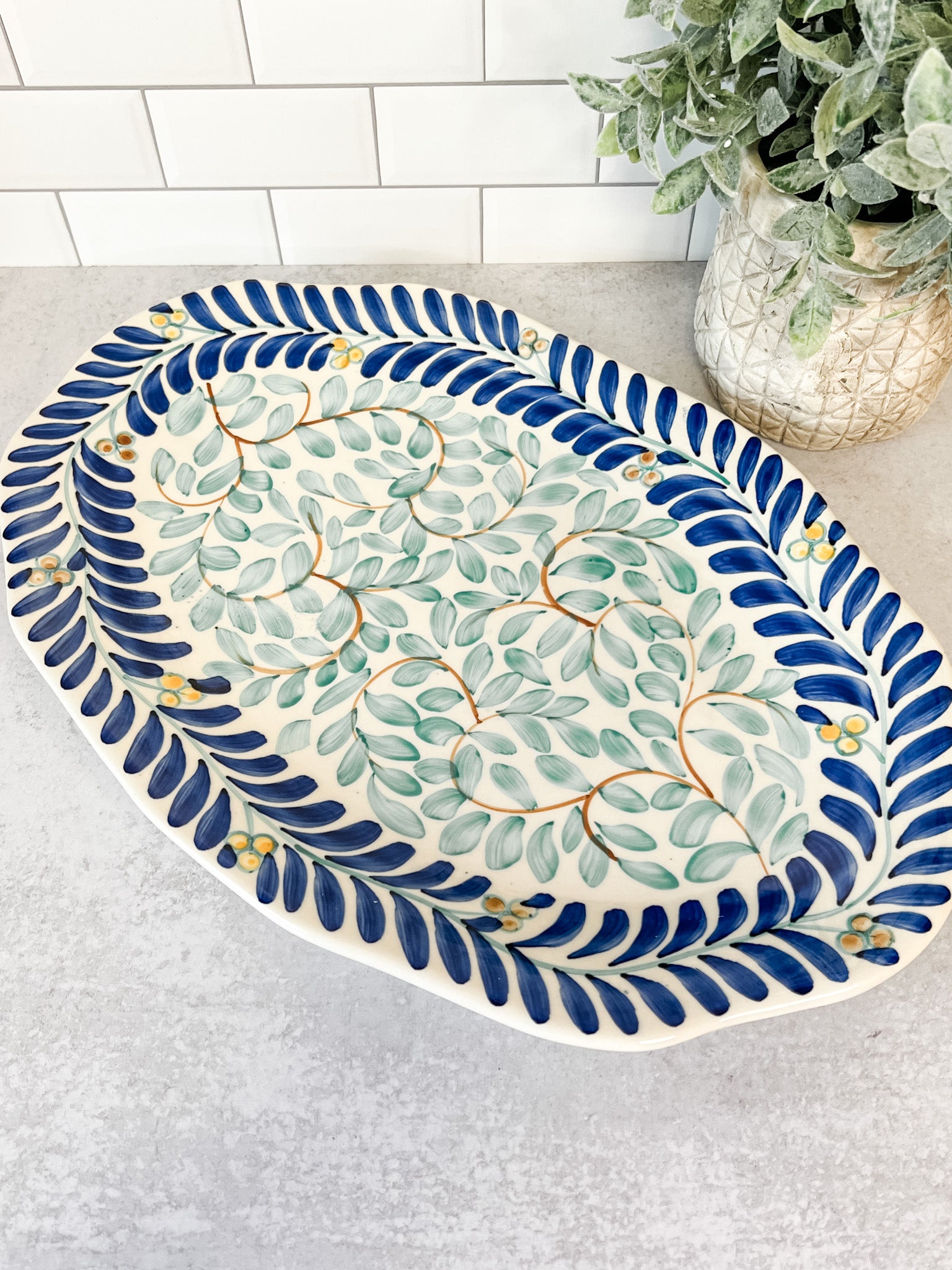 hand painted vine pattern blue and green stoneware oval platter at the rustic barn in killingworth ct
