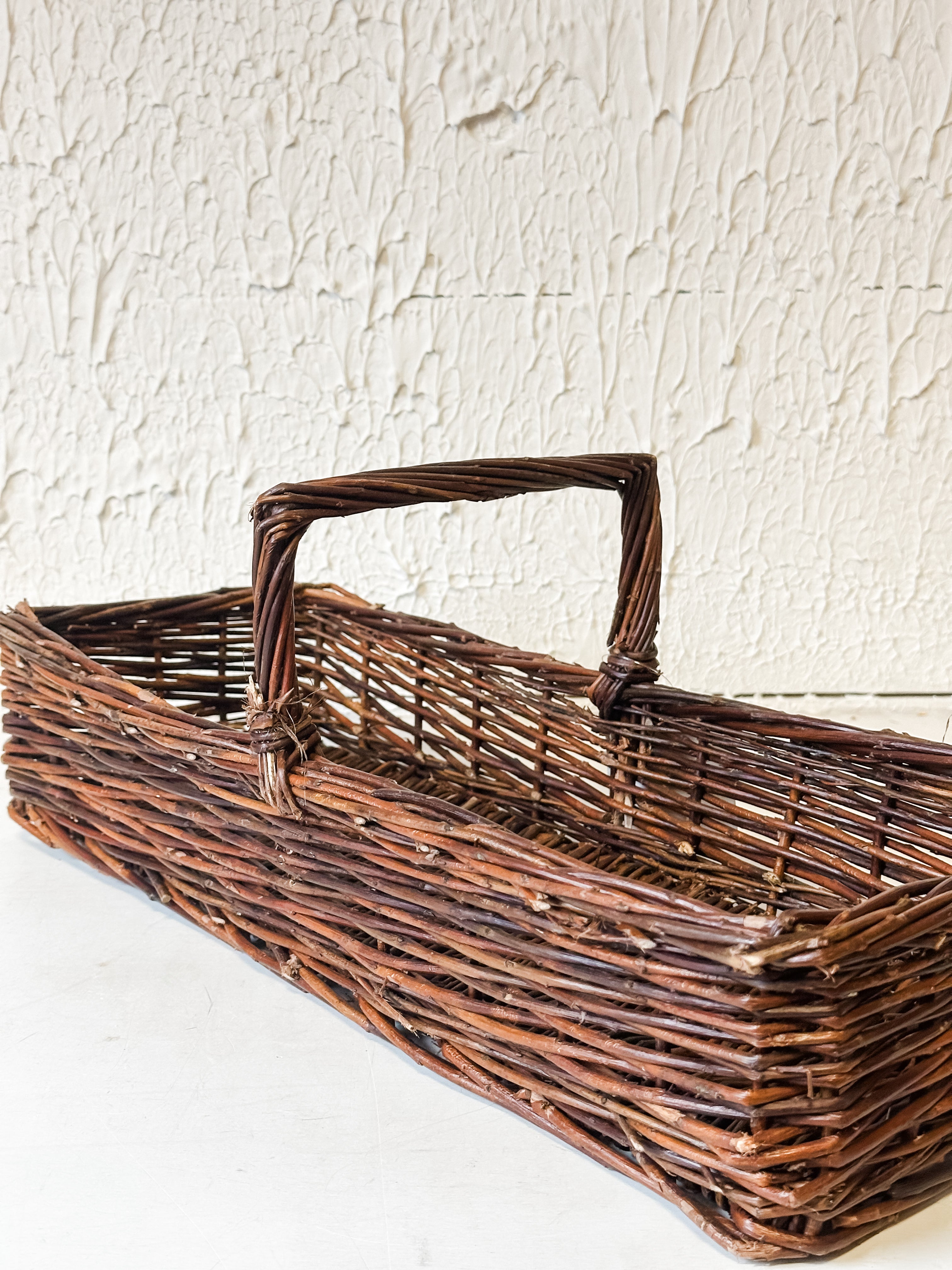 Artisan Hand-Woven Natural Reed Storage Basket with Handle at the Rustic Barn in Killingworth, CT