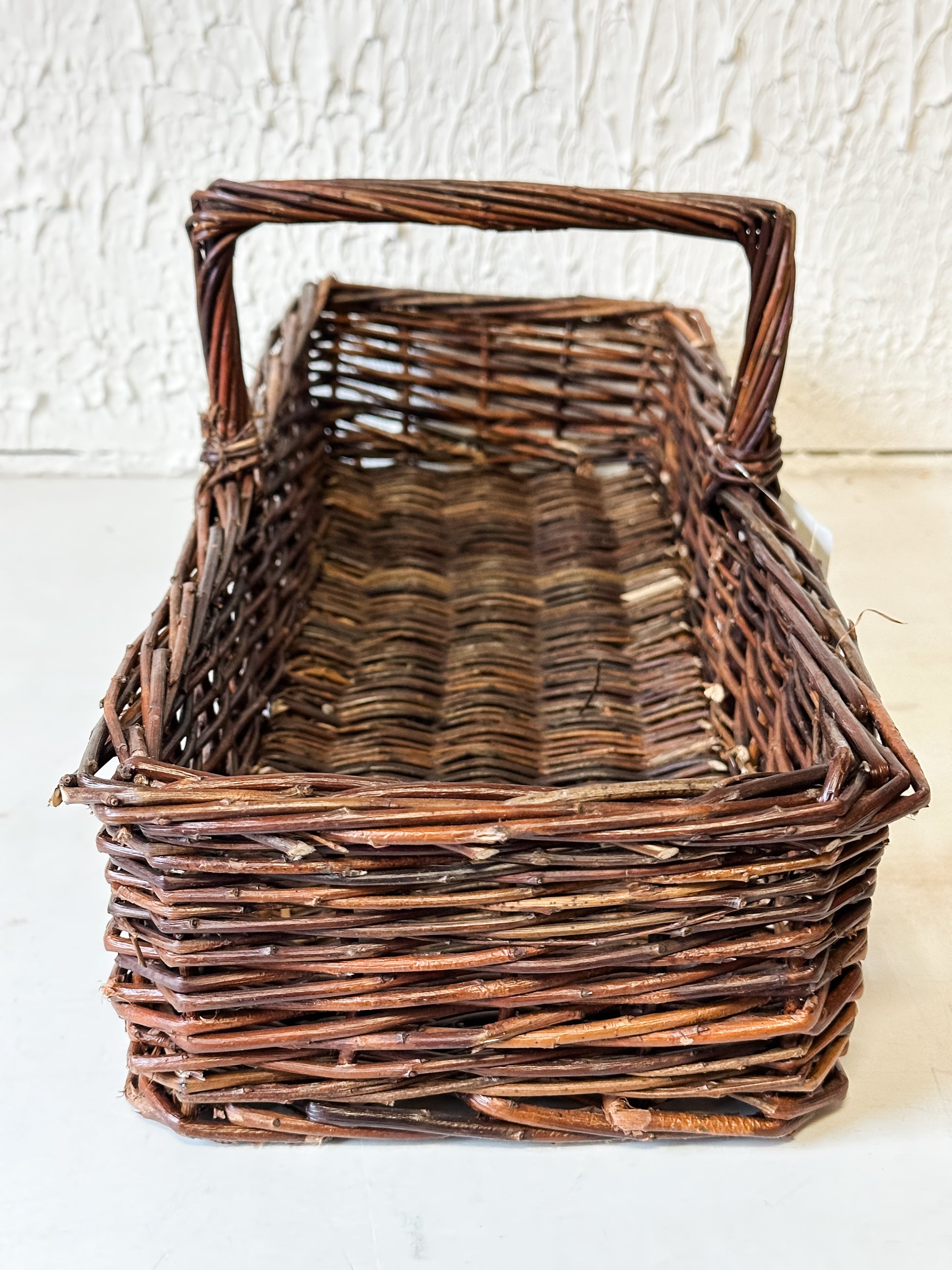 Artisan Hand-Woven Natural Reed Storage Basket with Handle at the Rustic Barn in Killingworth, CT