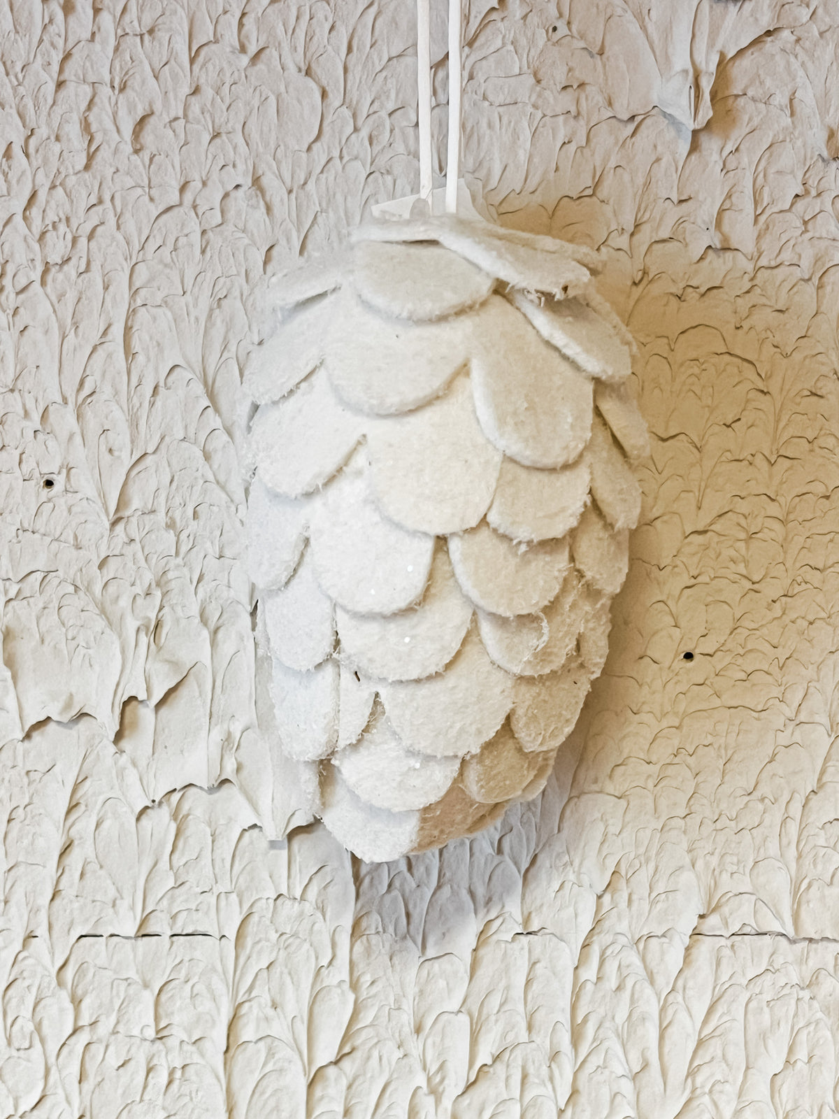 handcrafted felt cream pinecone ornament at the rustic barn in killingworth ct